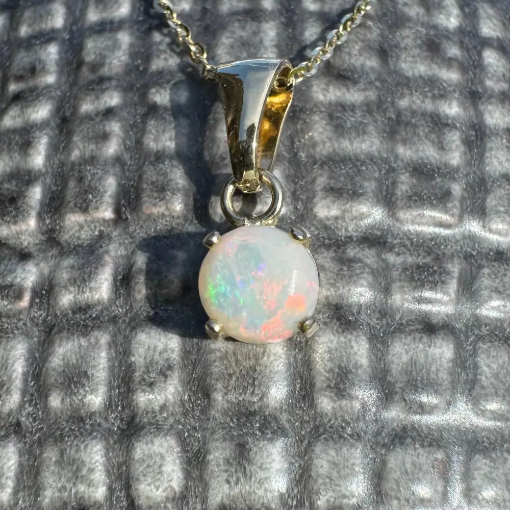 Opal pendant necklace from Outback Fire featuring a handcrafted 9ct solid gold Coober Pedy opal pendant