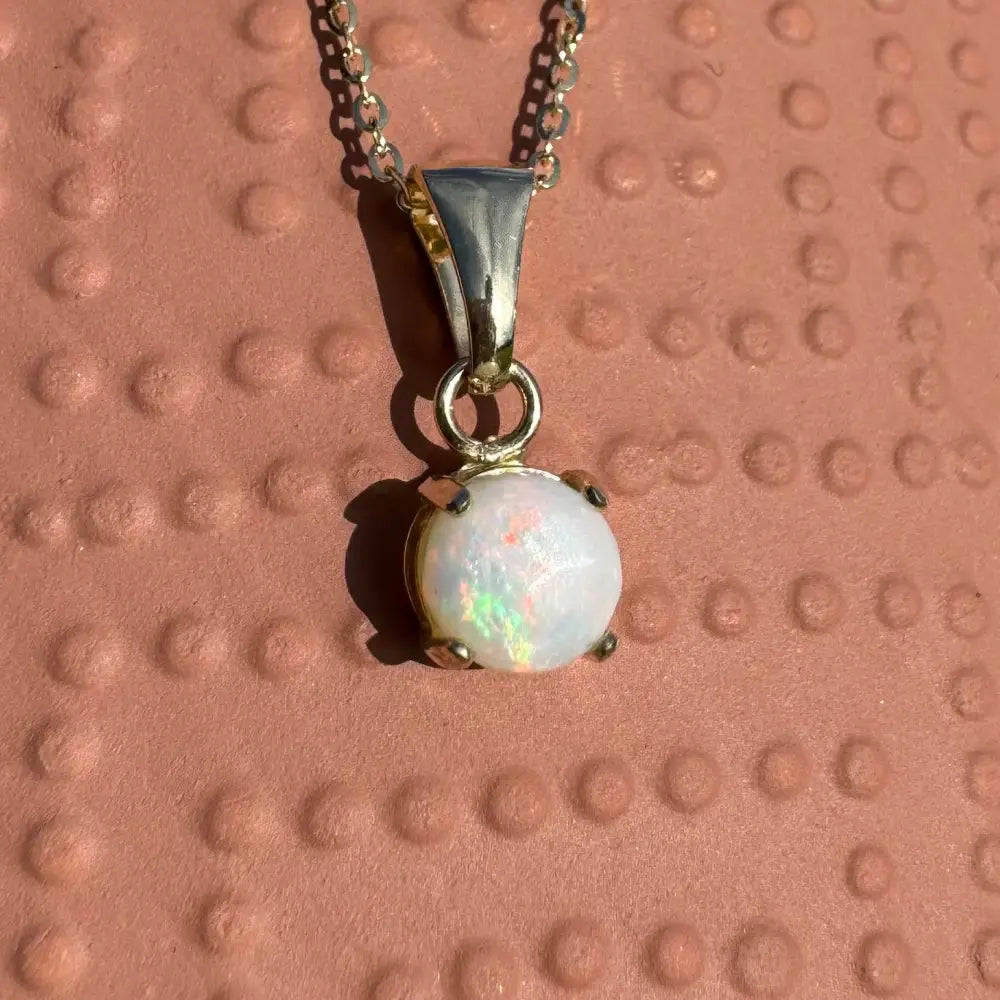 Silver necklace with iridescent Coober Pedy opal pendant from Outback Fire collection