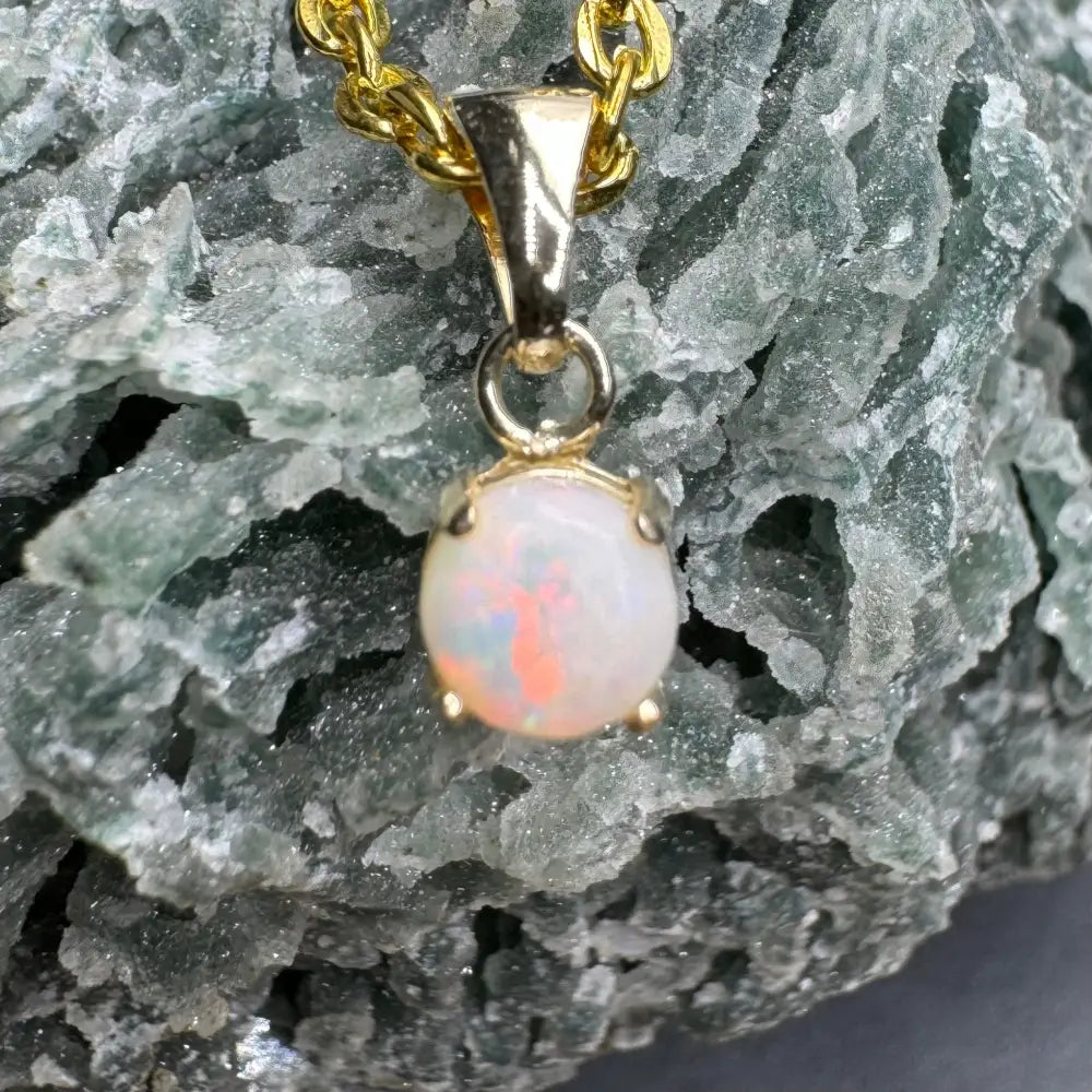 Gold chain with an opal pendant featuring a Coober Pedy fire opal in handcrafted 9ct solid gold