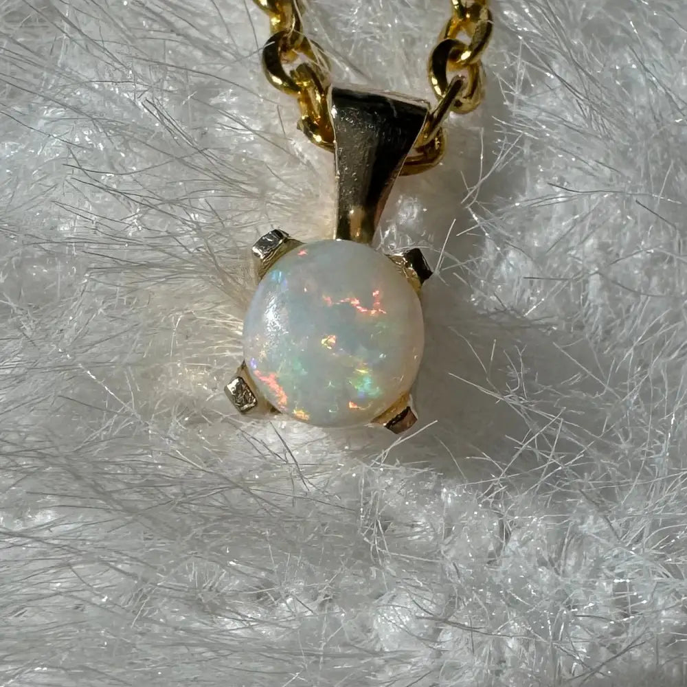 Gold chain necklace with a Coober Pedy Opal pendant from Outback Radiance collection