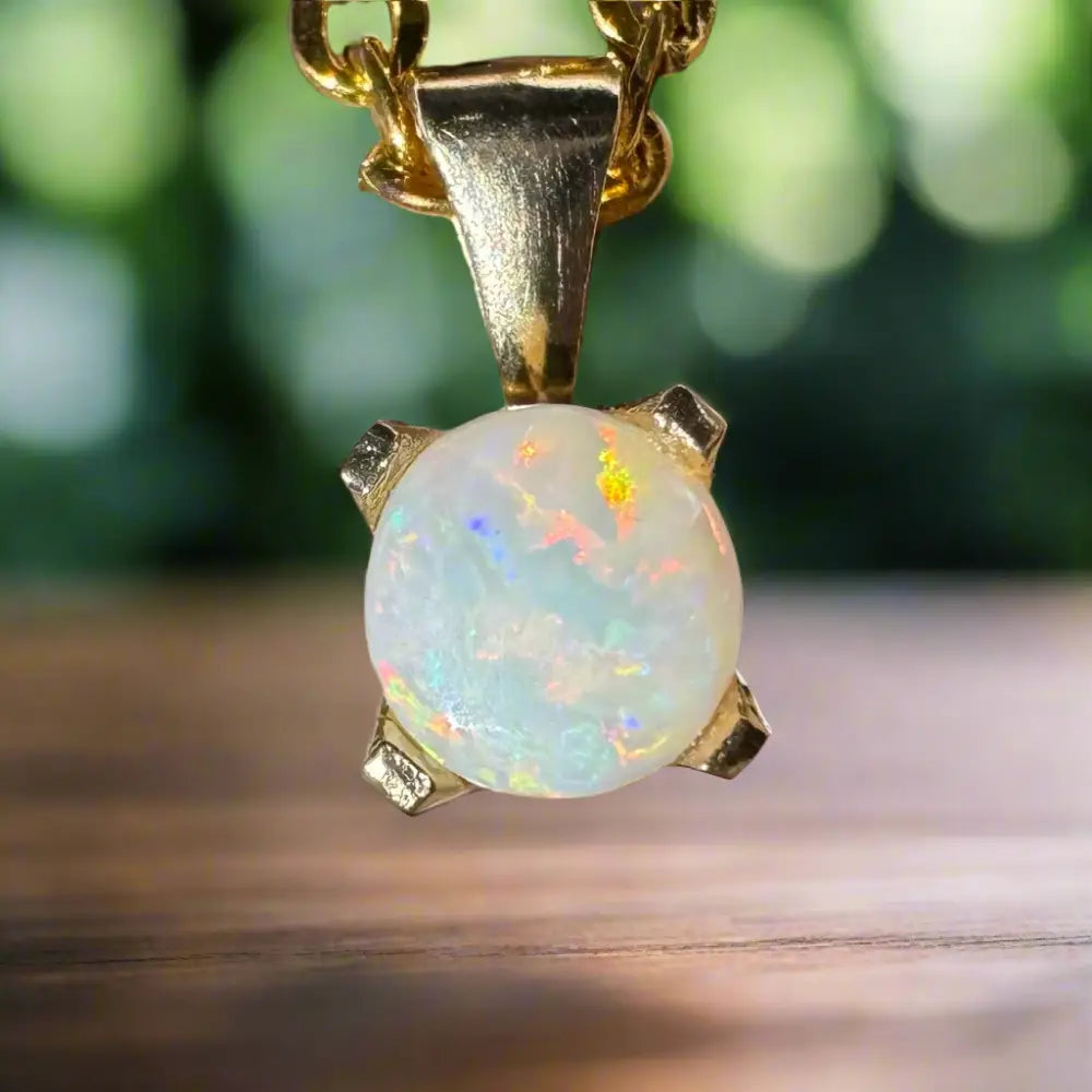 Gold Opal Pendant from Outback Radiance featuring a handcrafted 9ct solid gold and 0.8ct Coober Pedy opal