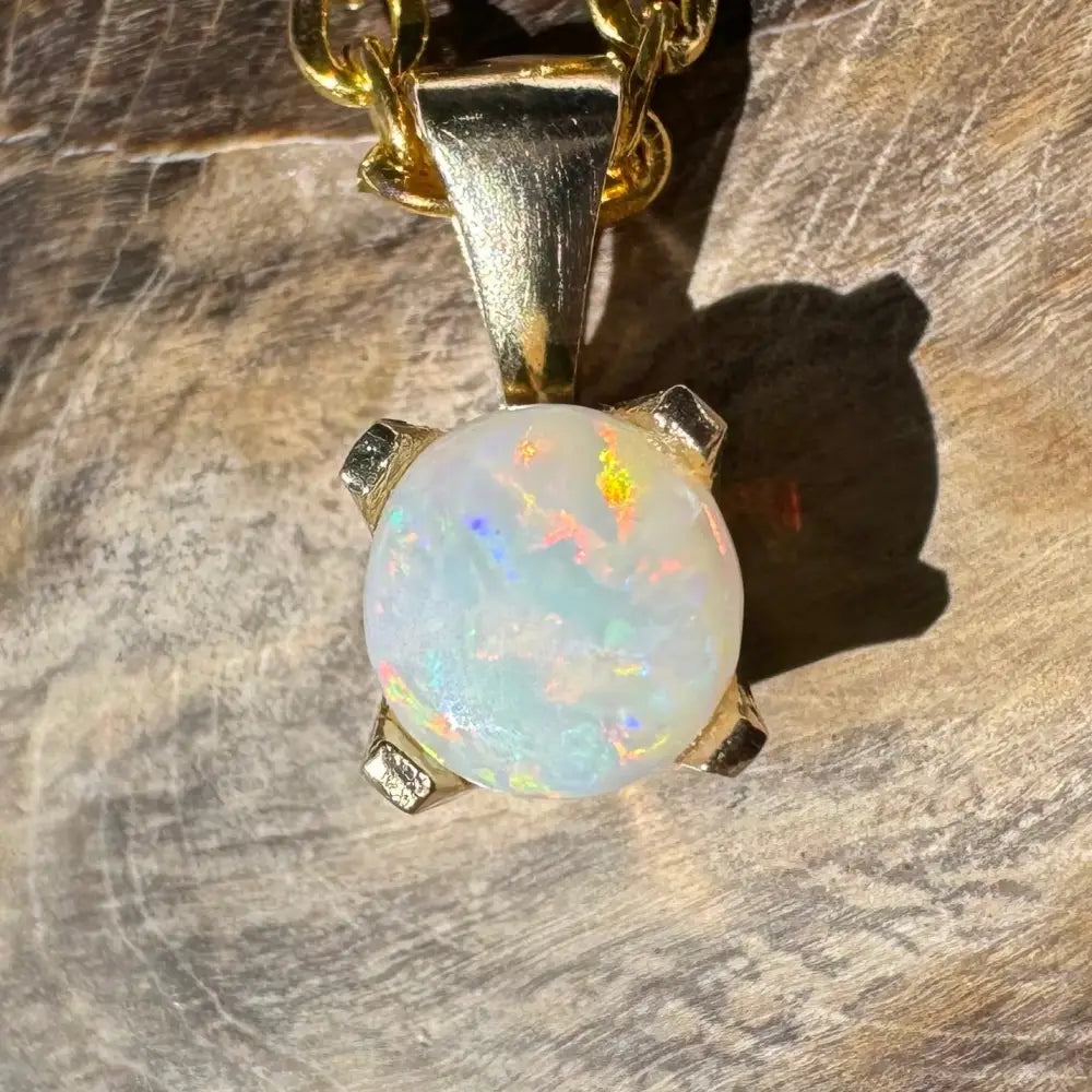 Gold opal pendant from Outback Radiance featuring a handcrafted 9ct solid gold setting with a 0.8ct Coober Pedy opal
