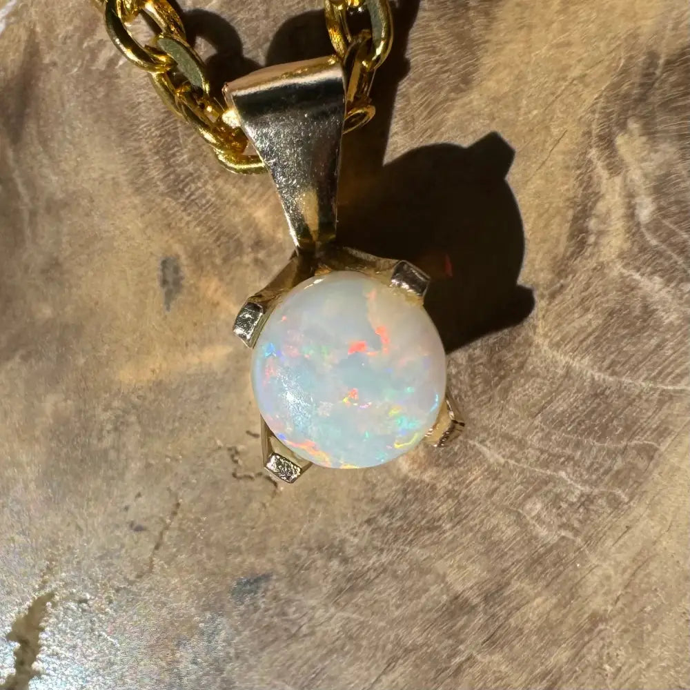 Gold pendant with iridescent Coober Pedy Opal from Outback Radiance collection