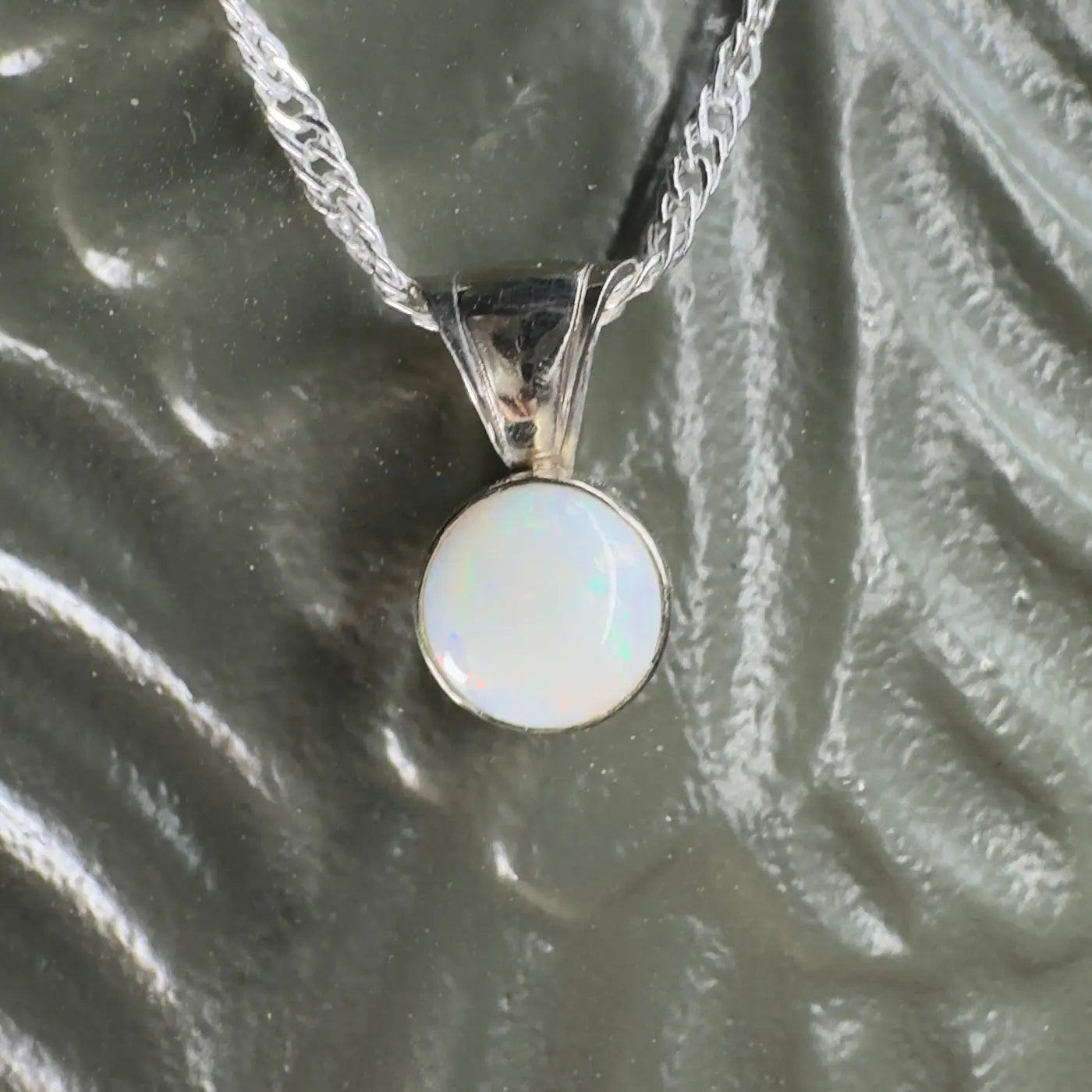 Silver chain necklace with a round Coober Pedy opal pendant from Outback to Ocean collection