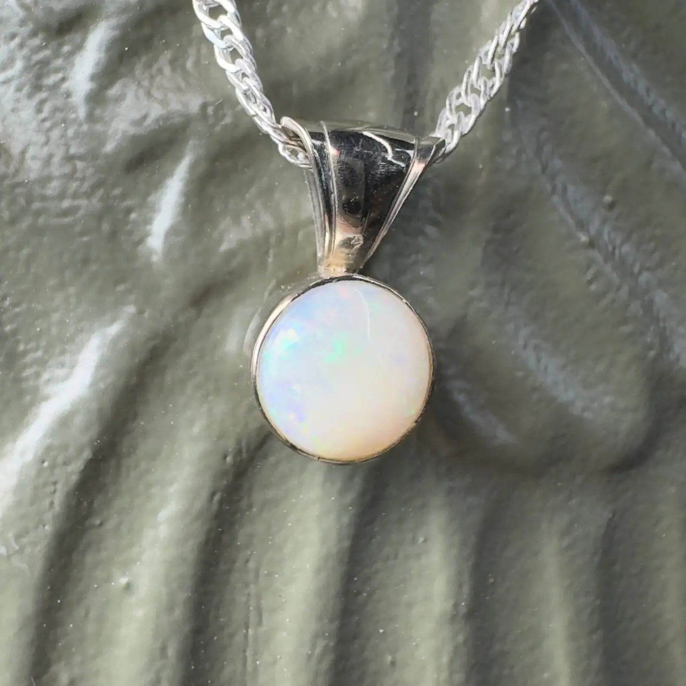 Silver pendant featuring a round Coober Pedy Opal from the Outback to Ocean collection