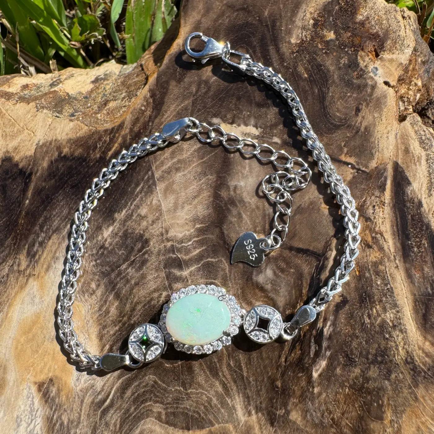 Silver bracelet with Coober Pedy opal and cubic zirconia accents in a handcrafted design
