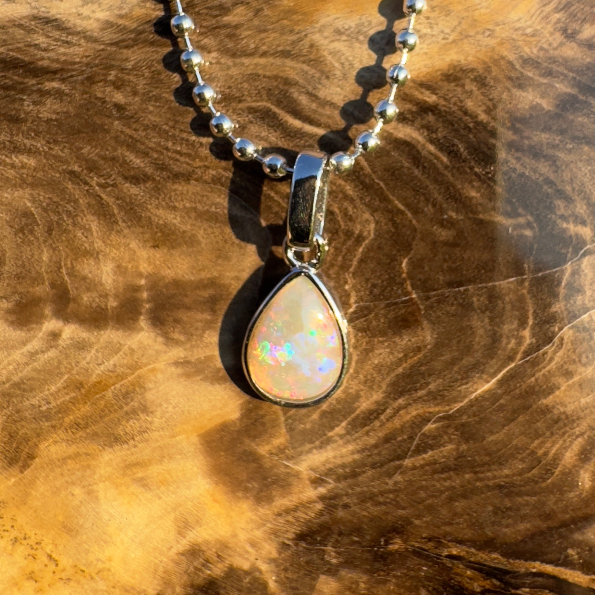 Rainlight Glow ~ Handcrafted 0.7ct Coober Pedy Crystal Opal Pendant – Silver Elegance.