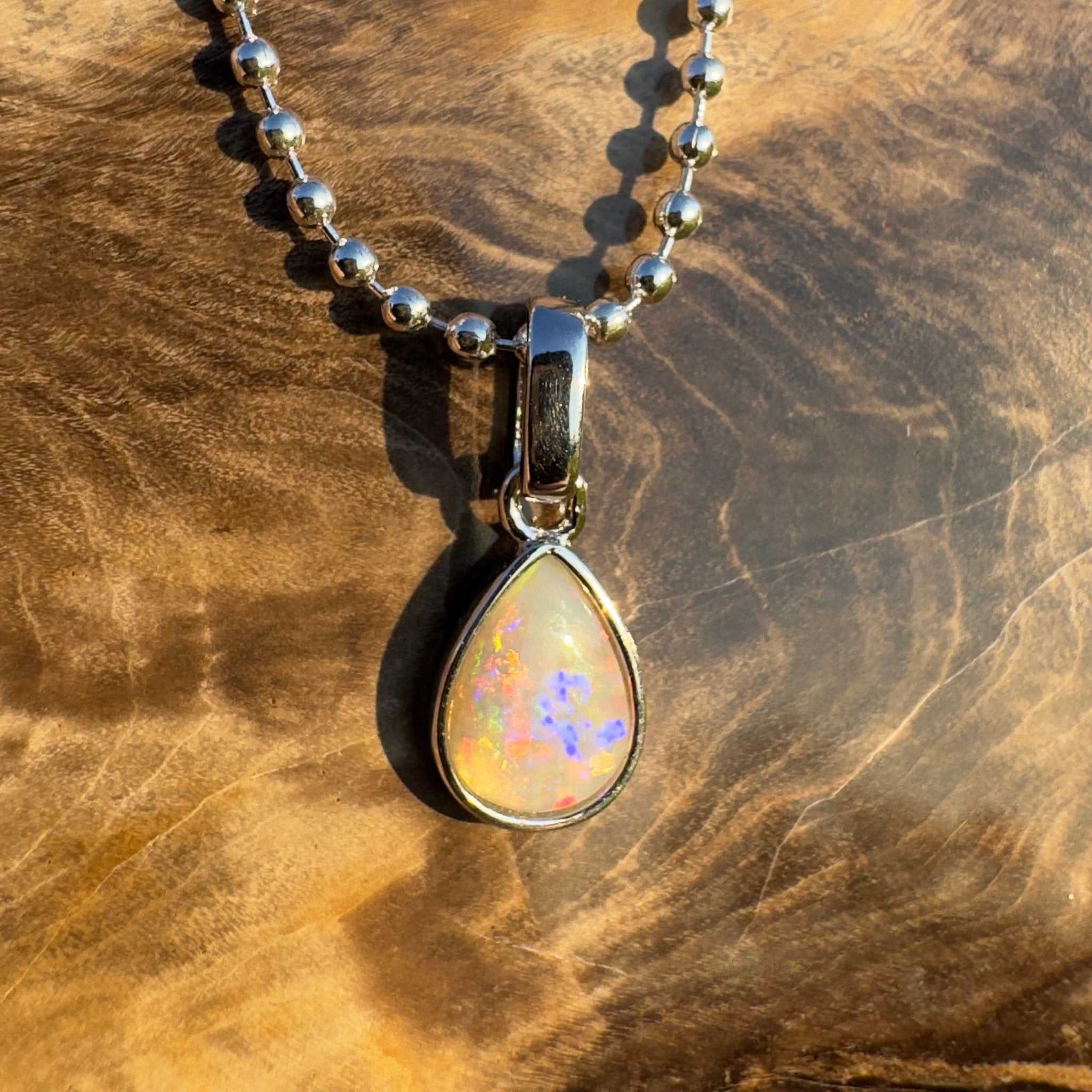 Rainlight Glow ~ Handcrafted 0.7ct Coober Pedy Crystal Opal Pendant – Silver Elegance.