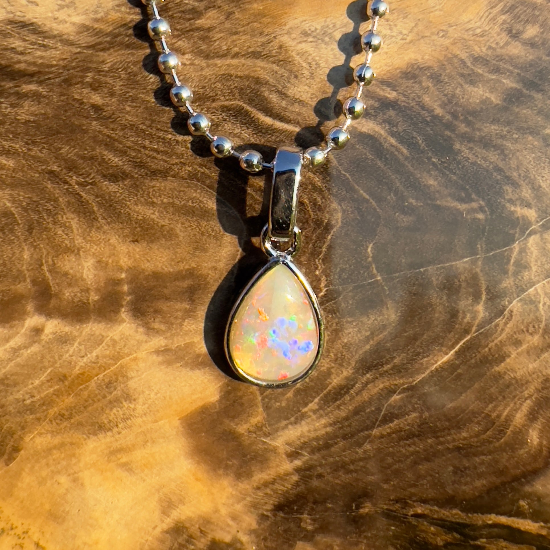 Rainlight Glow ~ Handcrafted 0.7ct Coober Pedy Crystal Opal Pendant – Silver Elegance.