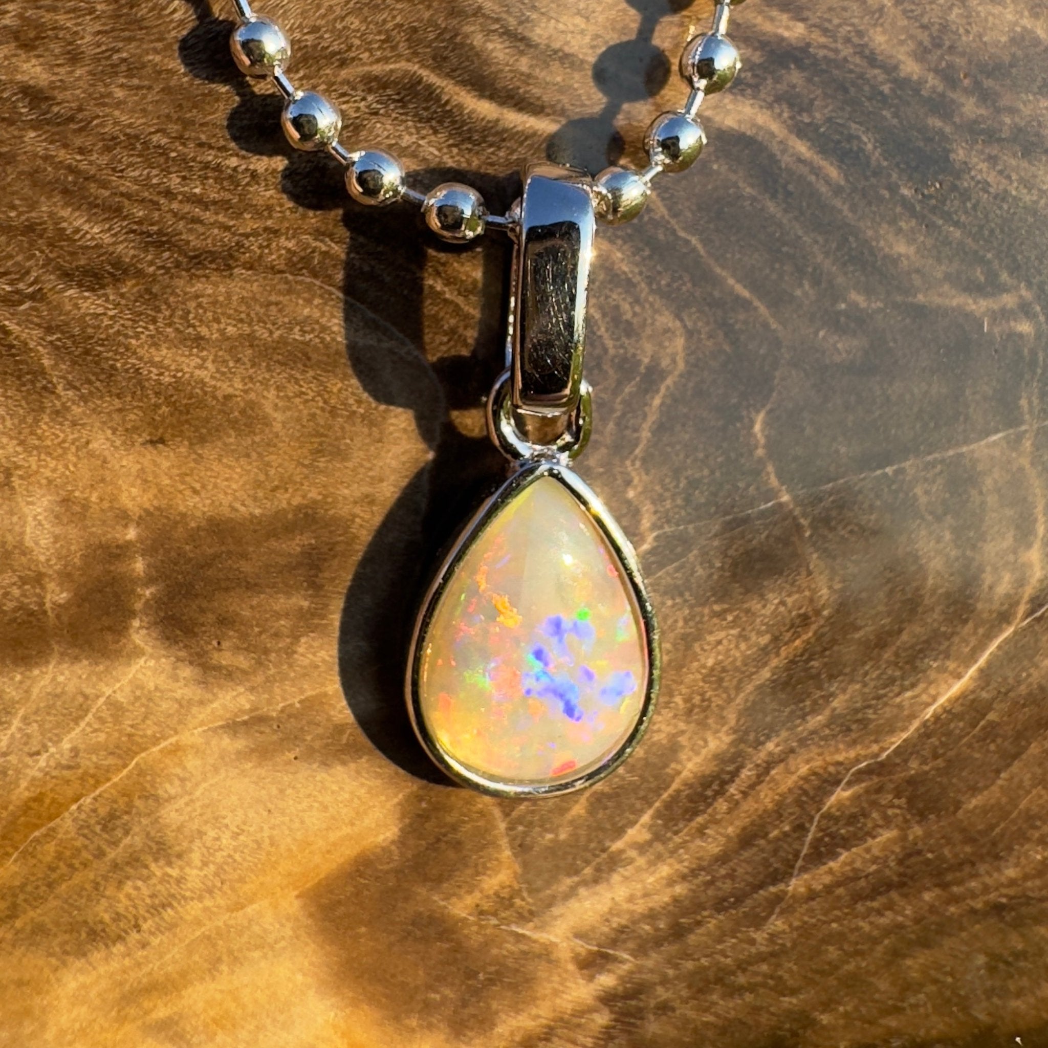 Rainlight Glow ~ Handcrafted 0.7ct Coober Pedy Crystal Opal Pendant – Silver Elegance.