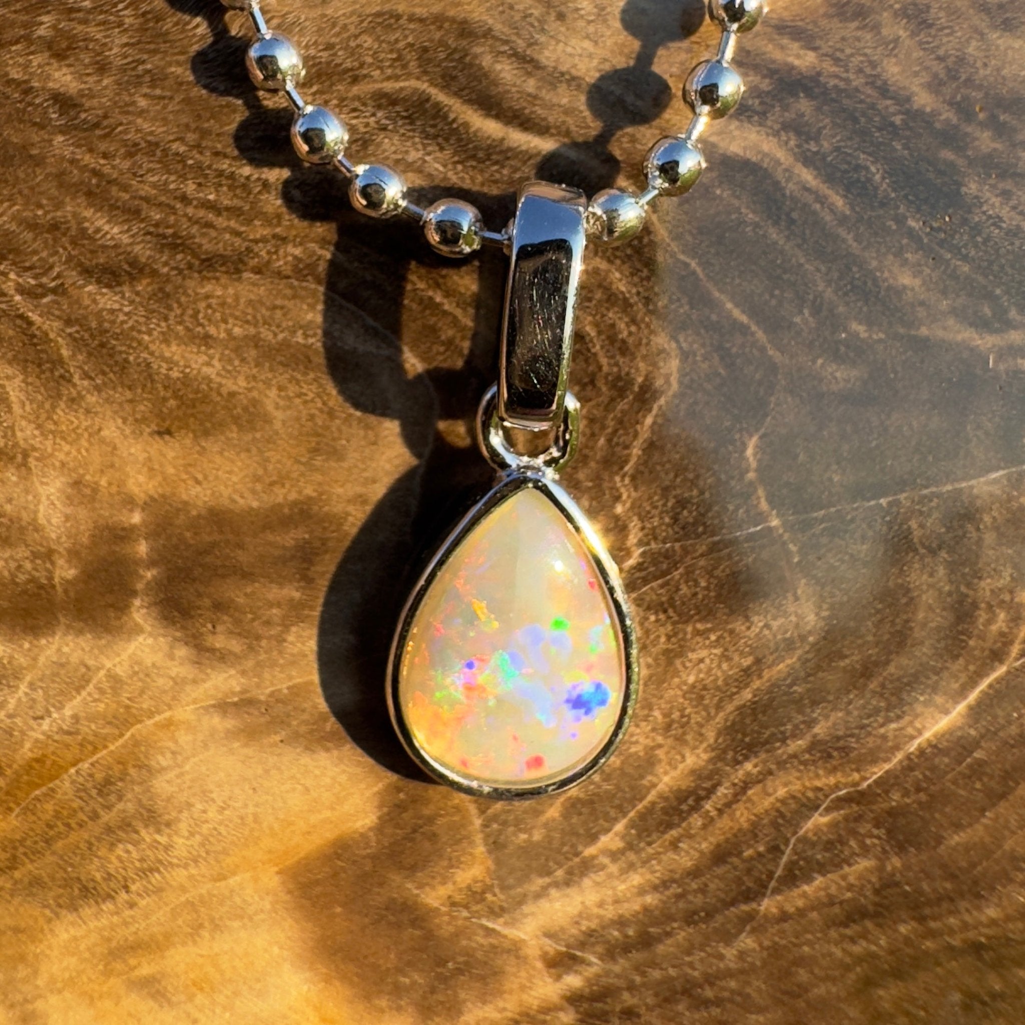 Rainlight Glow ~ Handcrafted 0.7ct Coober Pedy Crystal Opal Pendant – Silver Elegance.