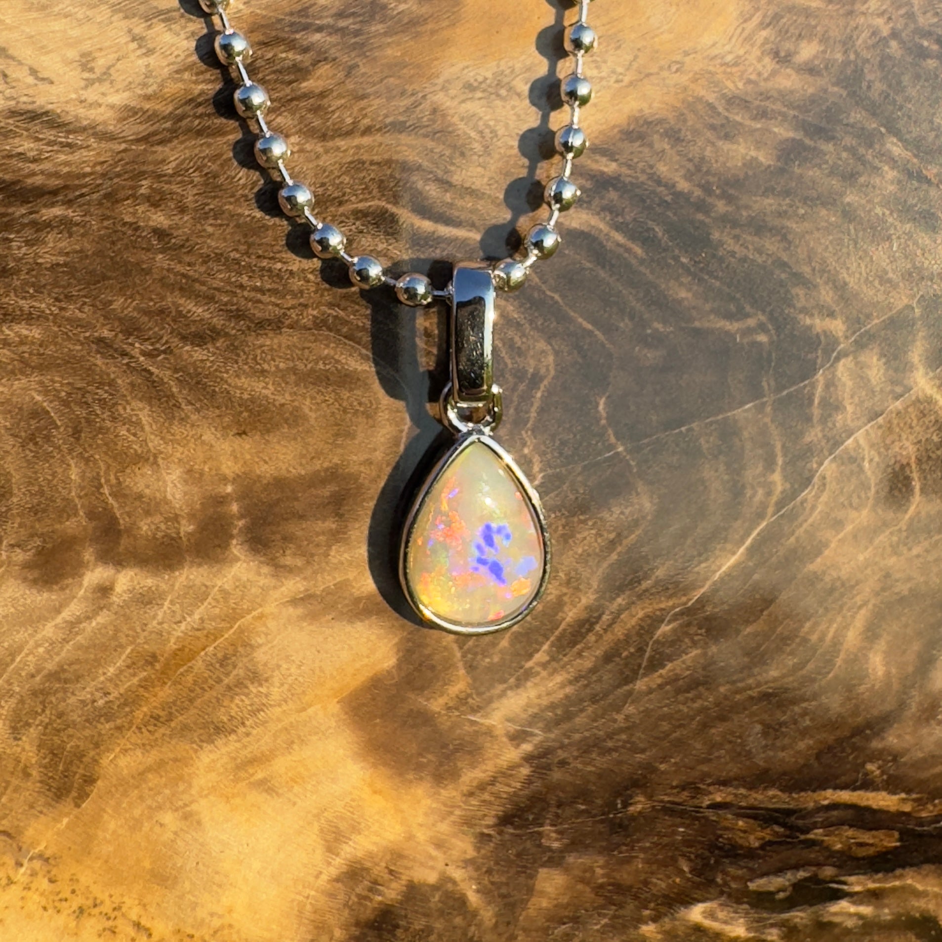 Rainlight Glow ~ Handcrafted 0.7ct Coober Pedy Crystal Opal Pendant – Silver Elegance.