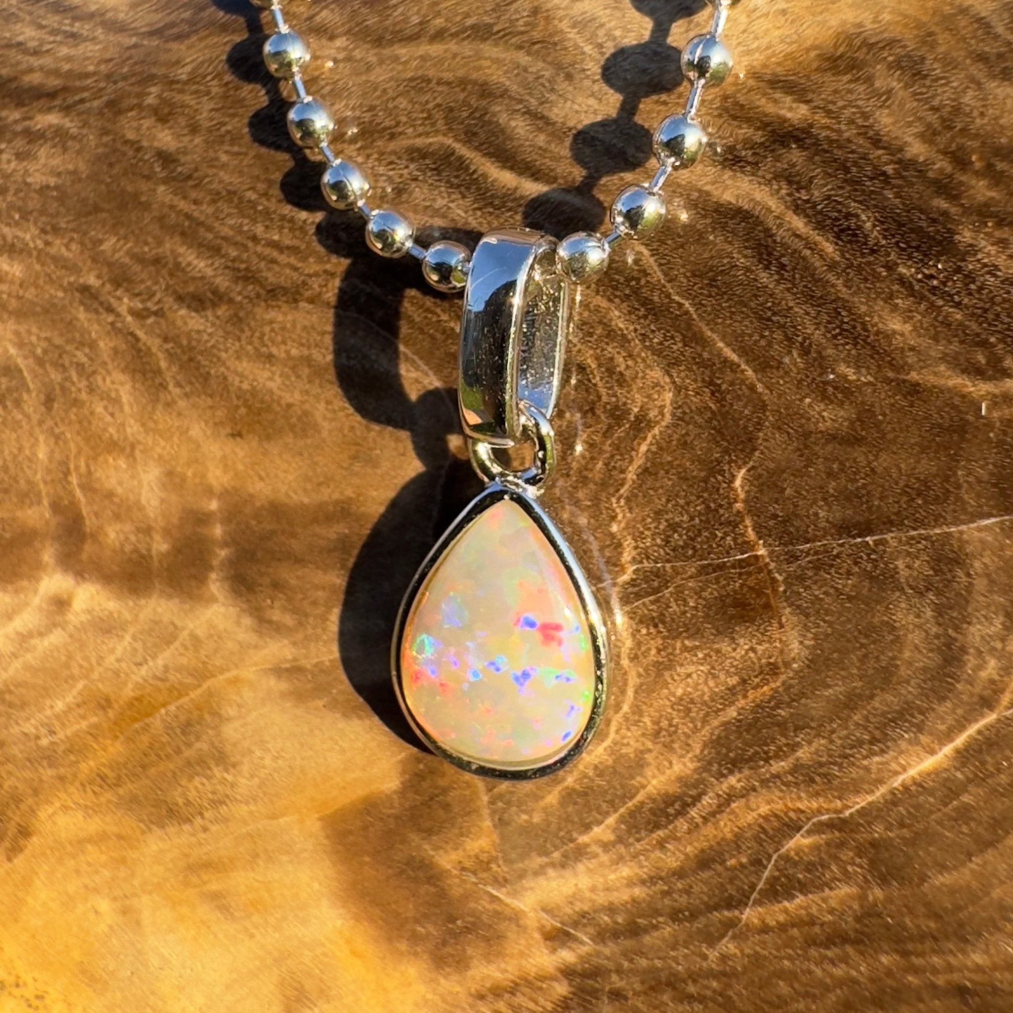 Rainlight Glow ~ Handcrafted 0.7ct Coober Pedy Crystal Opal Pendant – Silver Elegance.