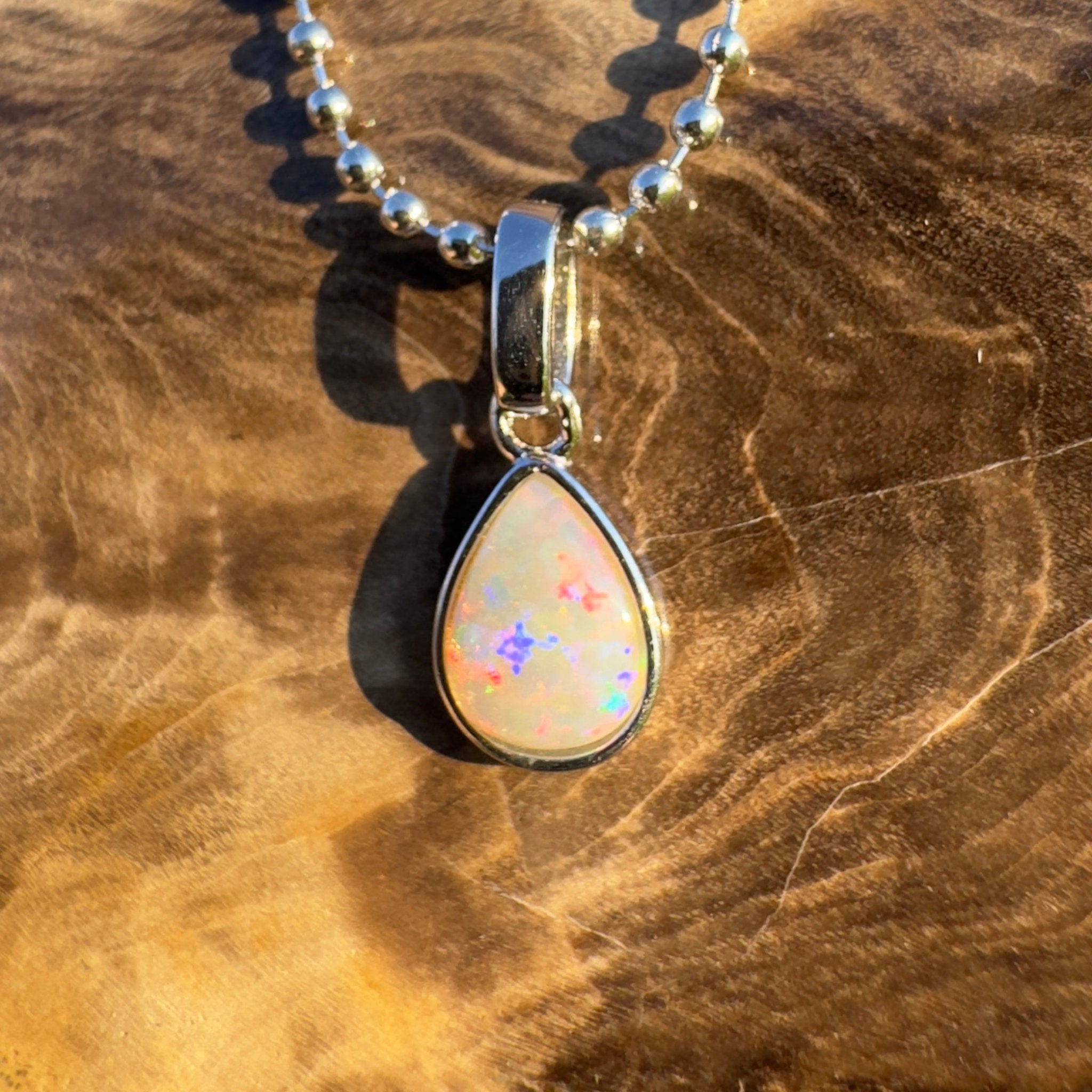 Rainlight Glow ~ Handcrafted 0.7ct Coober Pedy Crystal Opal Pendant – Silver Elegance.