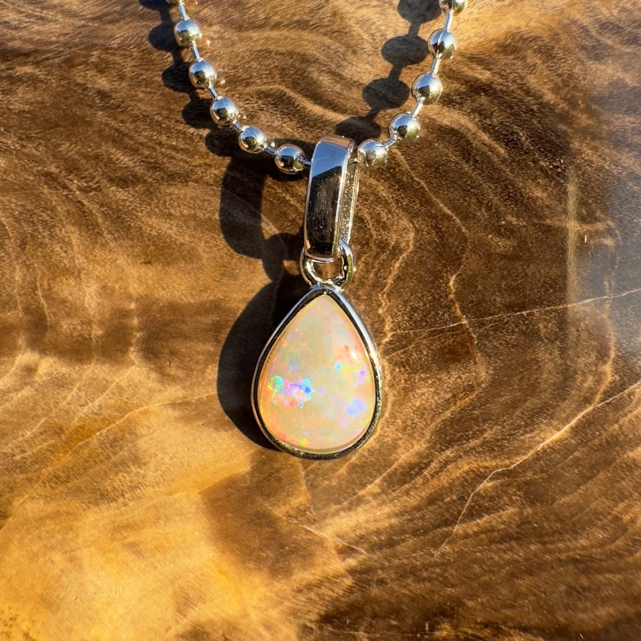 Rainlight Glow ~ Handcrafted 0.7ct Coober Pedy Crystal Opal Pendant – Silver Elegance.