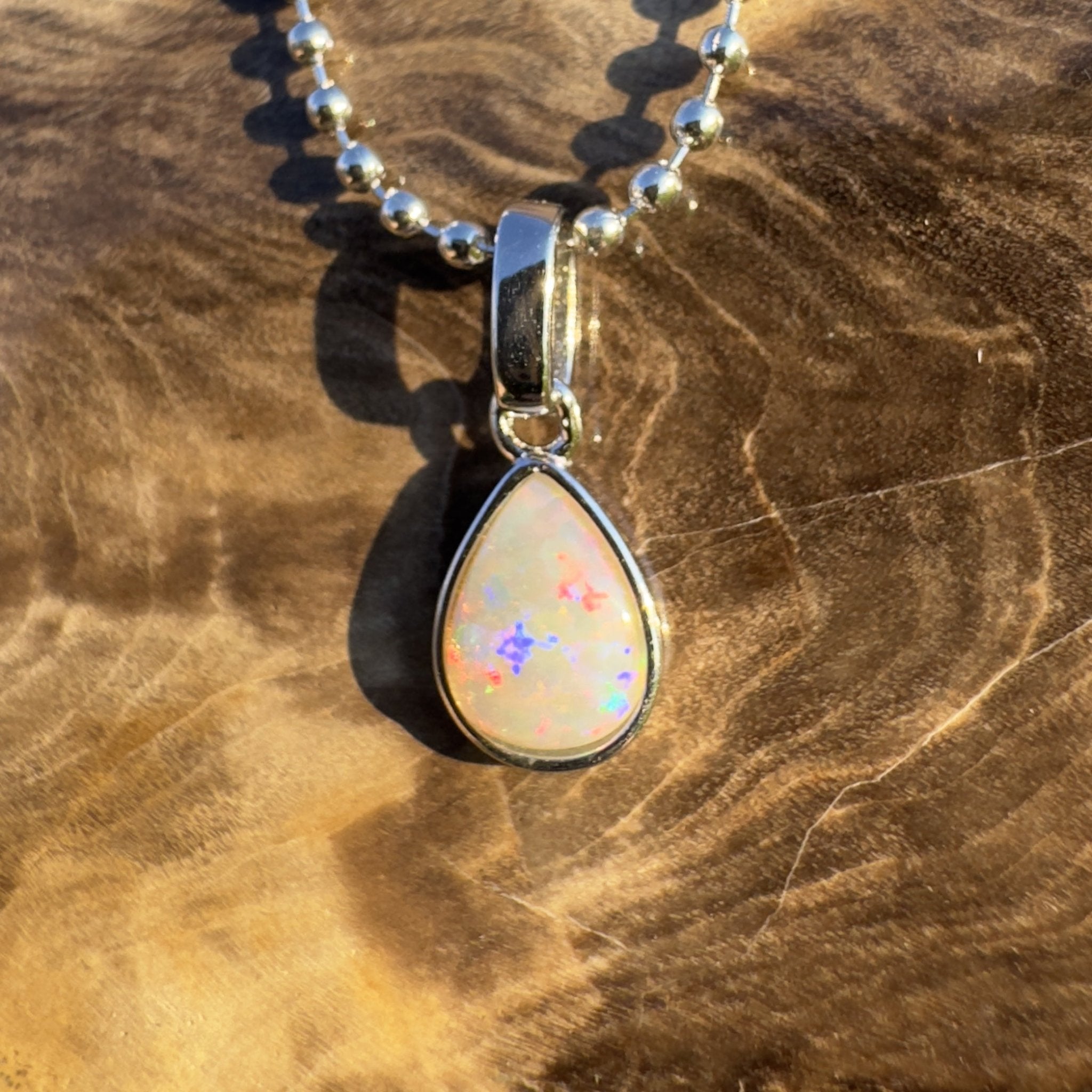 Rainlight Glow ~ Handcrafted 0.7ct Coober Pedy Crystal Opal Pendant – Silver Elegance.