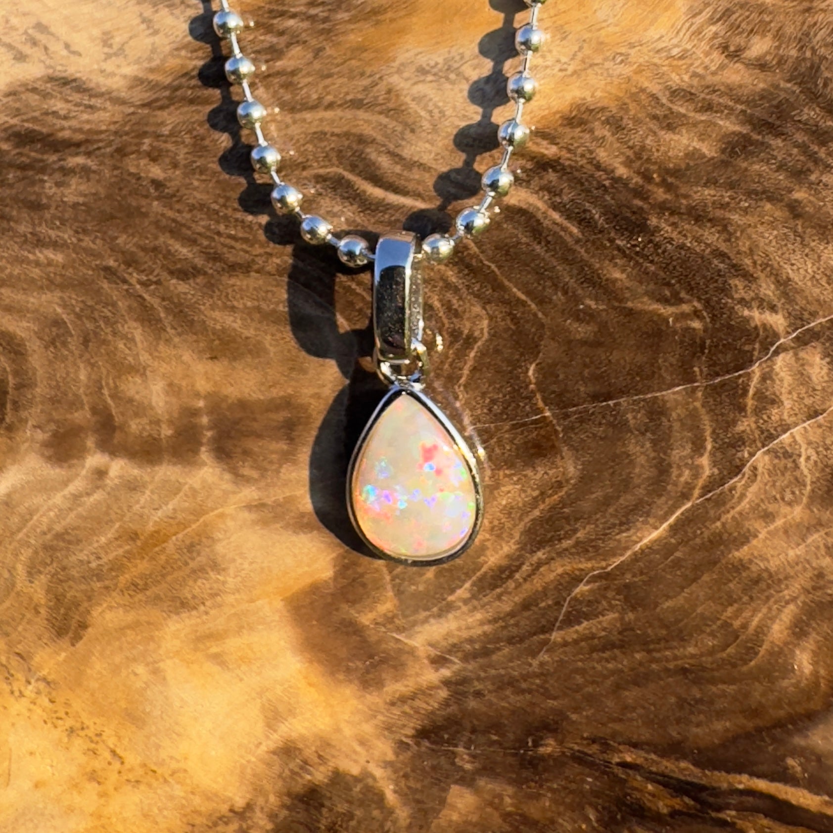 Rainlight Glow ~ Handcrafted 0.7ct Coober Pedy Crystal Opal Pendant – Silver Elegance.