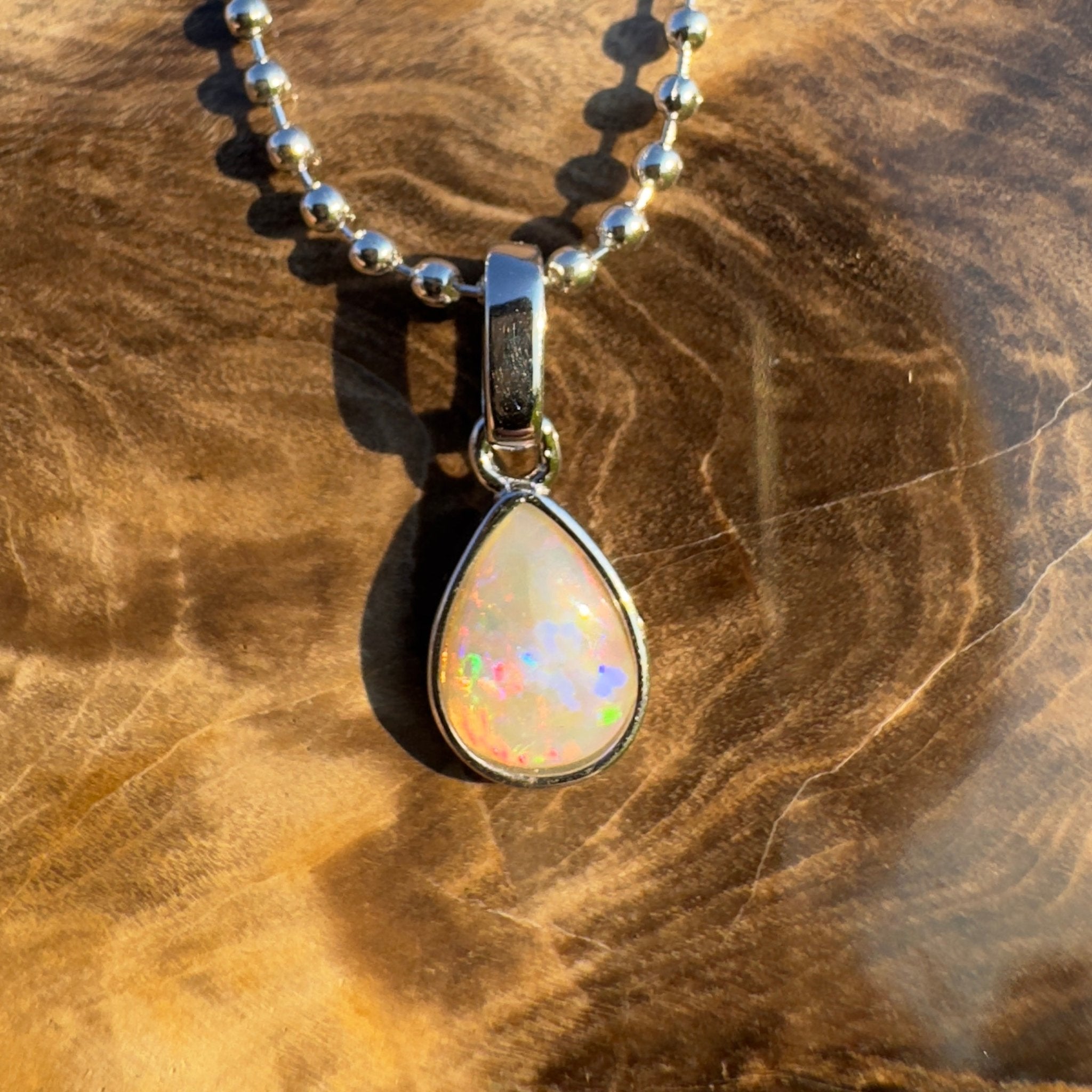 Rainlight Glow ~ Handcrafted 0.7ct Coober Pedy Crystal Opal Pendant – Silver Elegance.