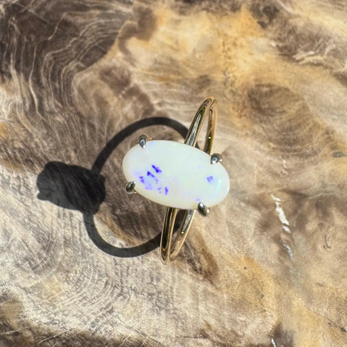 Oval opal ring with gold band from Rolling Colours of Coober handcrafted Coober Pedy opal jewelry