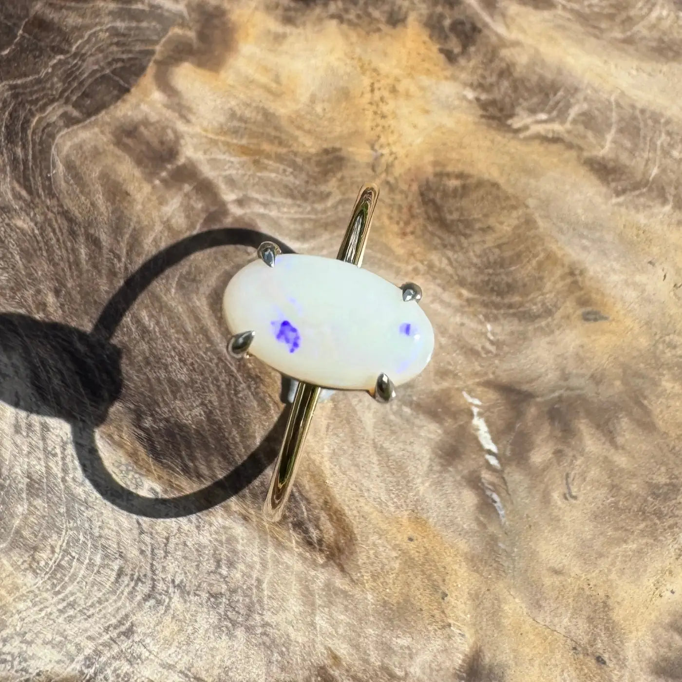 Oval opal ring with blue spots in handcrafted Coober Pedy 9ct yellow gold setting
