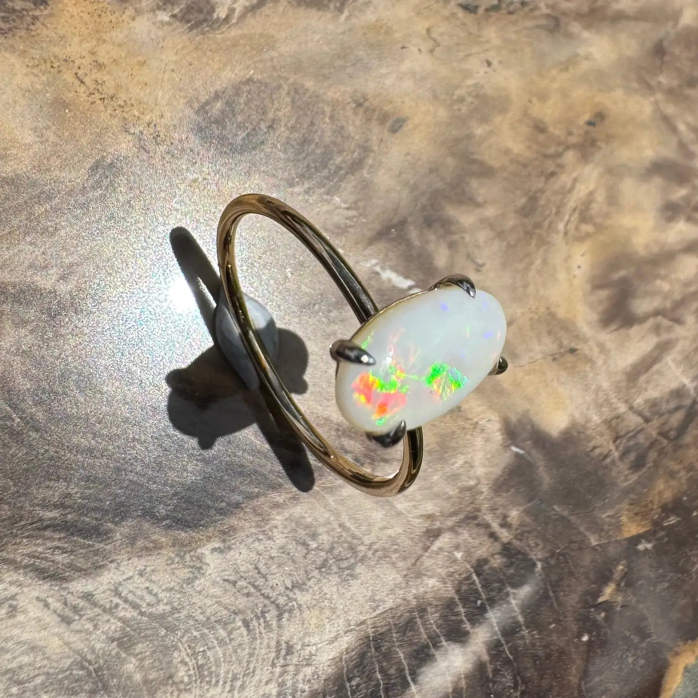 Opal ring with vibrant colorful flashes handcrafted in 9ct yellow gold from Coober Pedy