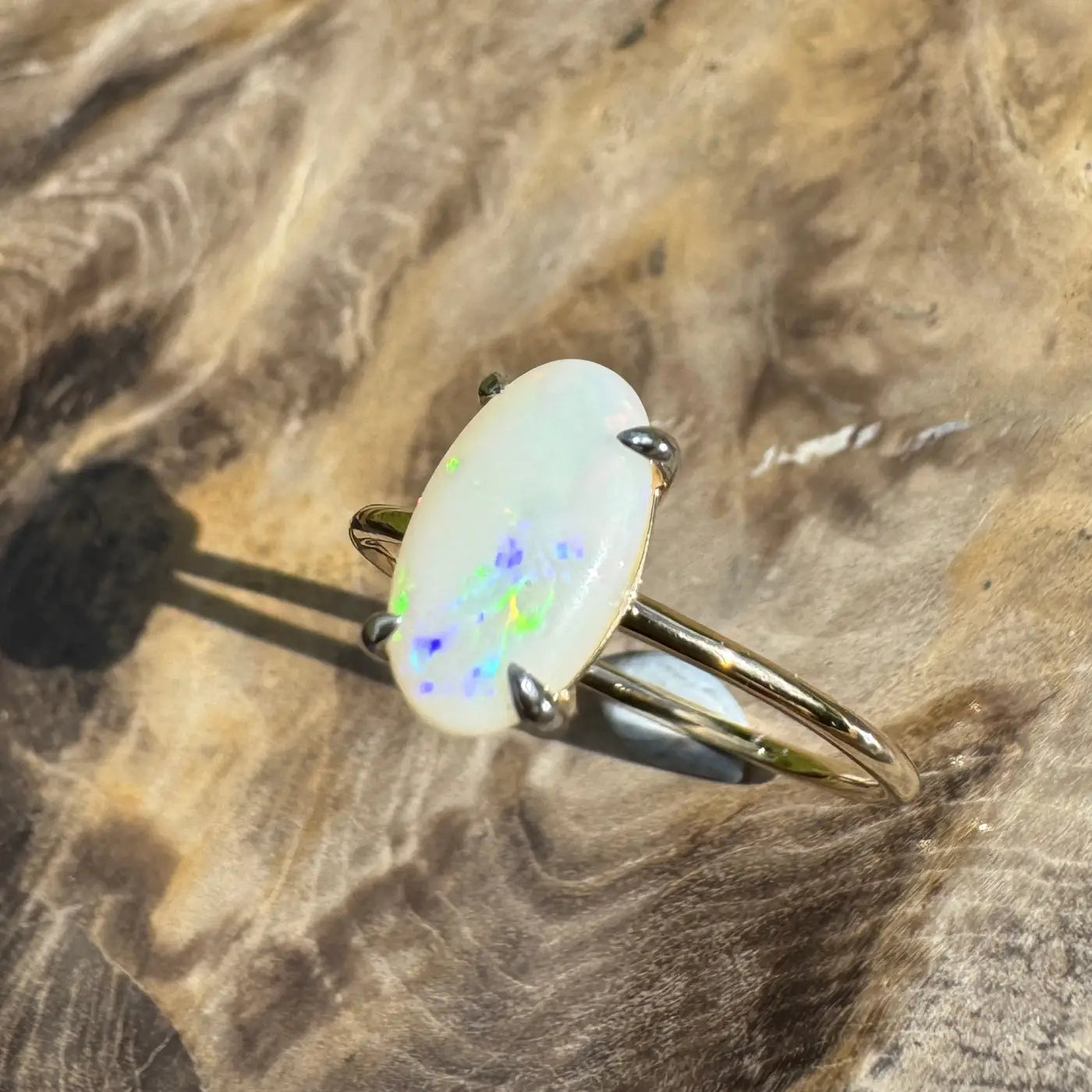 Handcrafted 0.9ct Solid Coober Pedy Opal gold ring featuring vibrant rolling colors