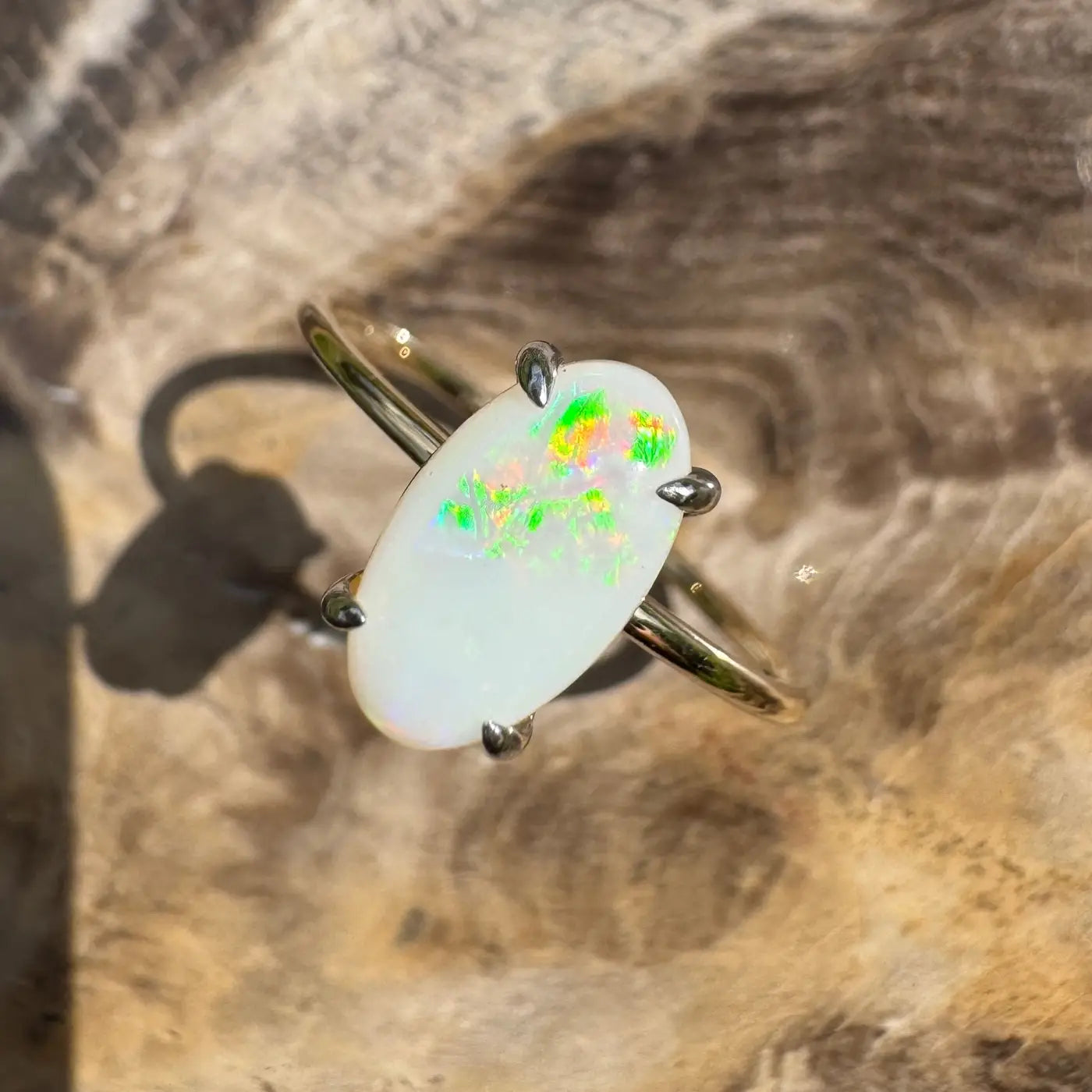 Opal ring with gold band in Rolling Colours of Coober handcrafted jewelry collection