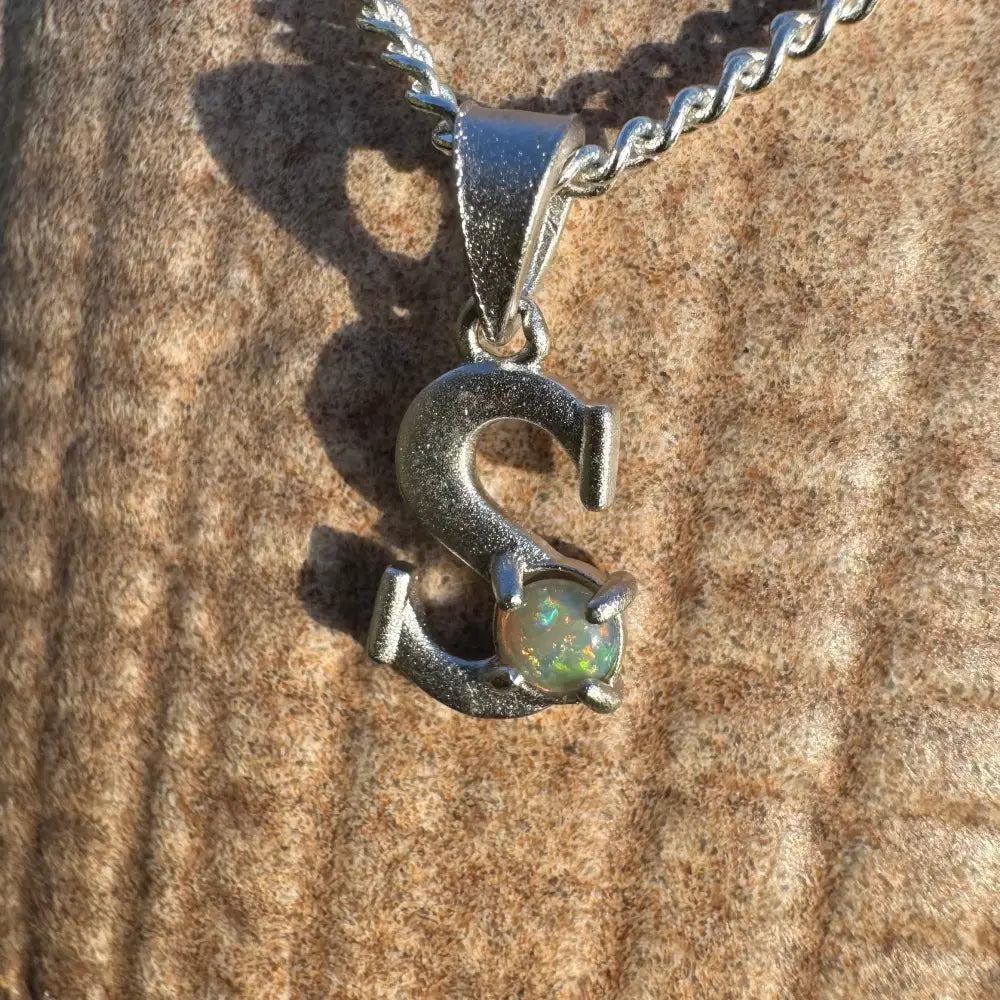 Silver S pendant featuring a 0.2ct Lightning Ridge Opal in sterling silver craftsmanship