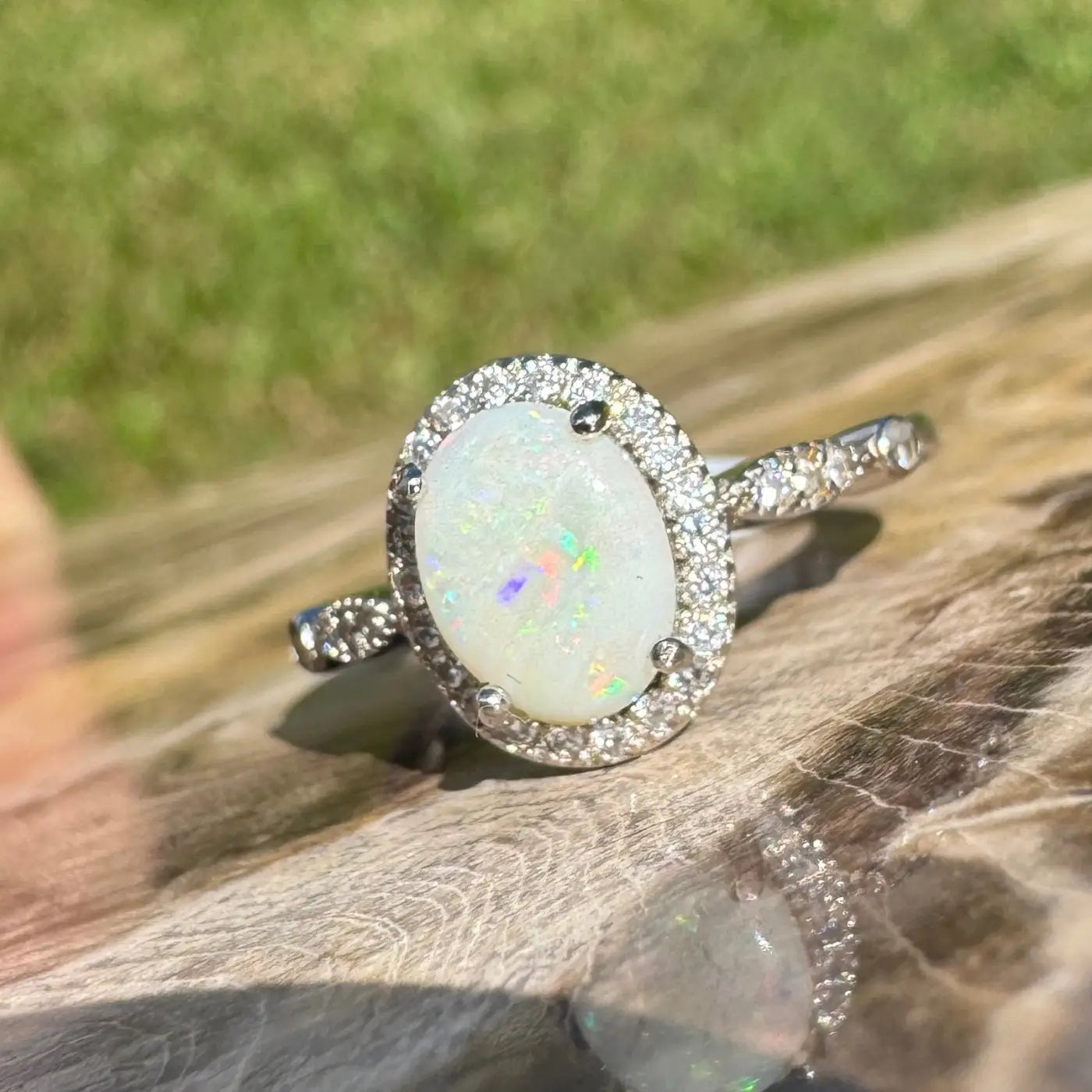 Oval opal ring with diamond halo from Snowy Peaks handcrafted sterling silver collection