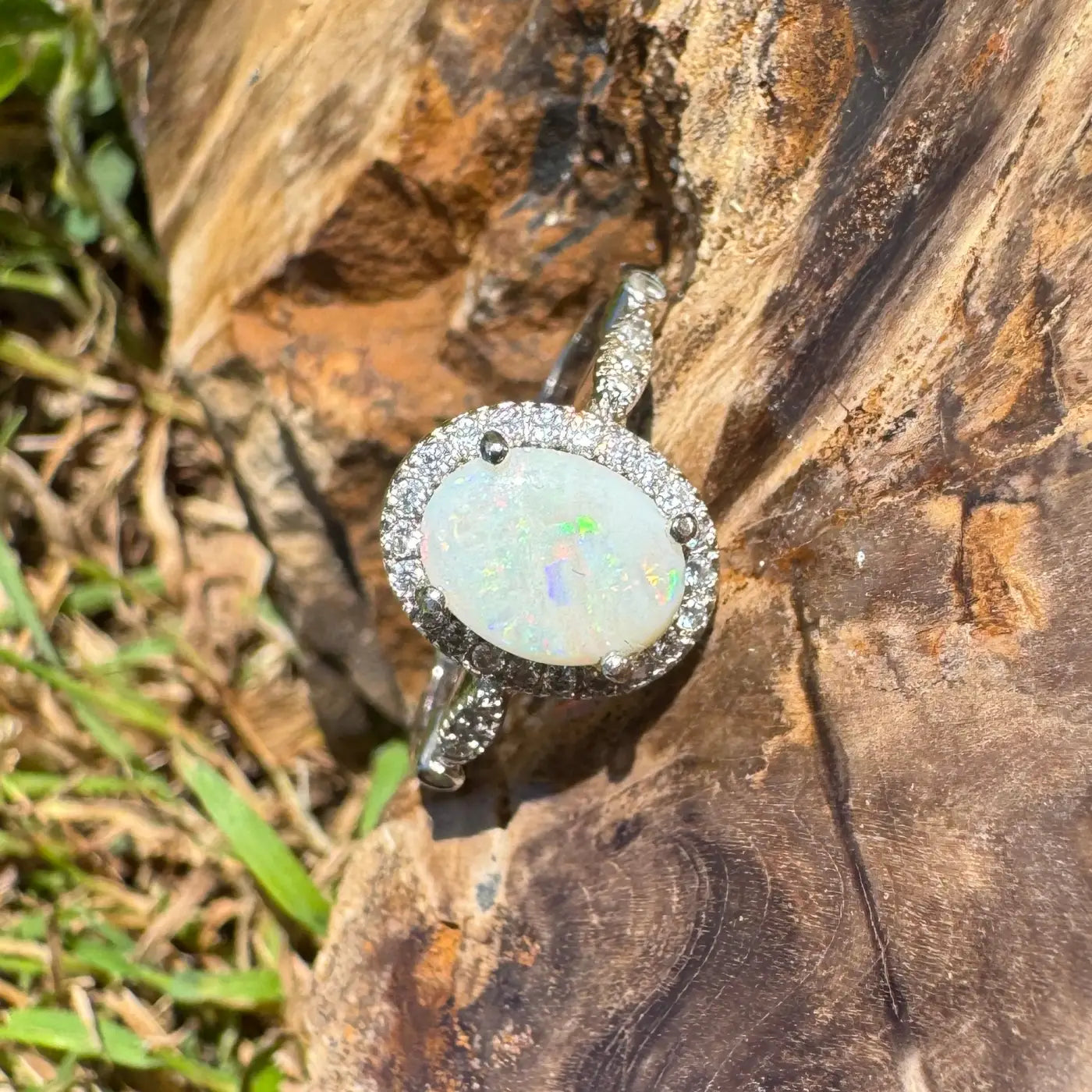 Oval opal ring with diamond halo from Snowy Peaks handcrafted sterling silver jewelry
