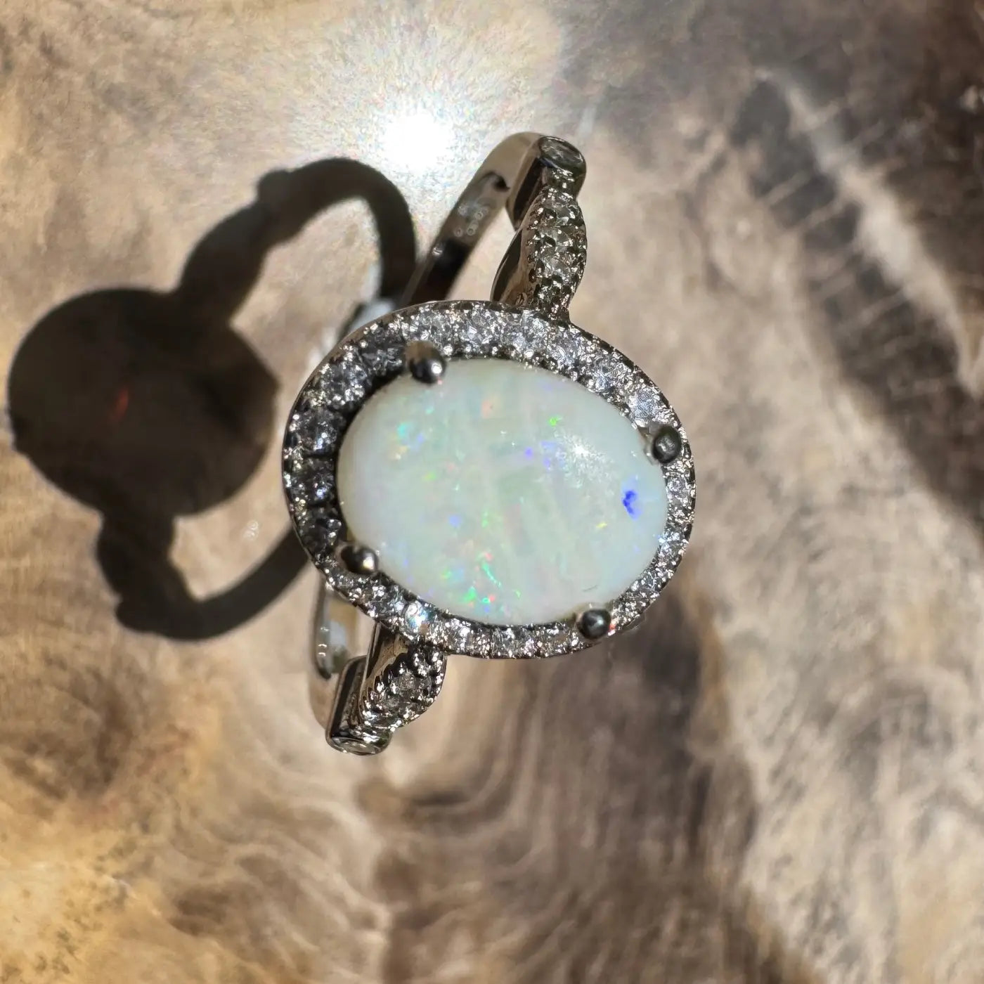 Opal ring with diamond halo from Snowy Peaks handcrafted in sterling silver