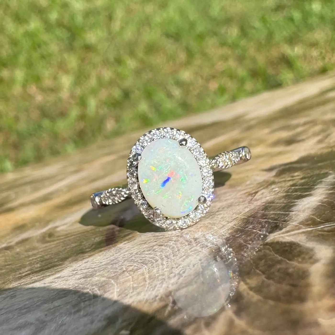 Oval opal ring with diamond halo from Snowy Peaks handcrafted 925 silver jewelry