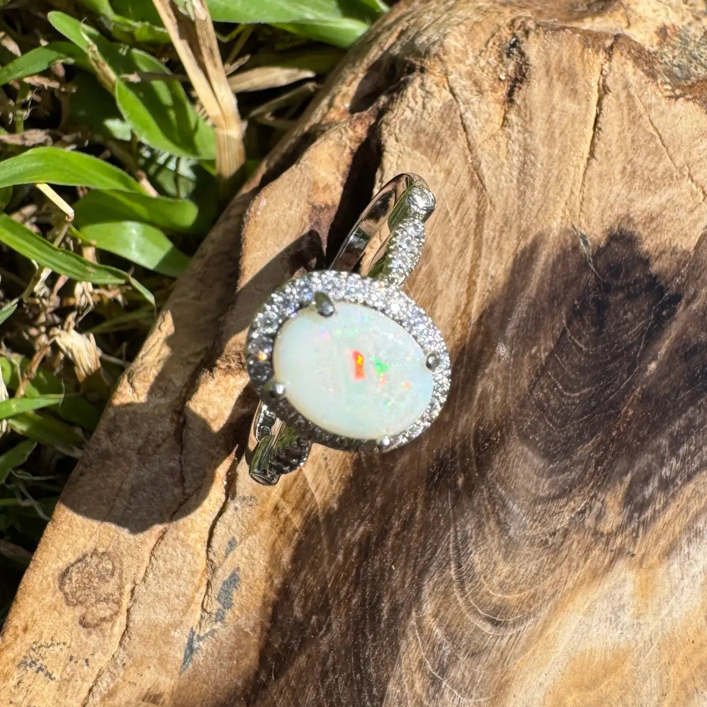 Oval opal ring with diamond halo from Snowy Peaks handcrafted sterling silver jewelry