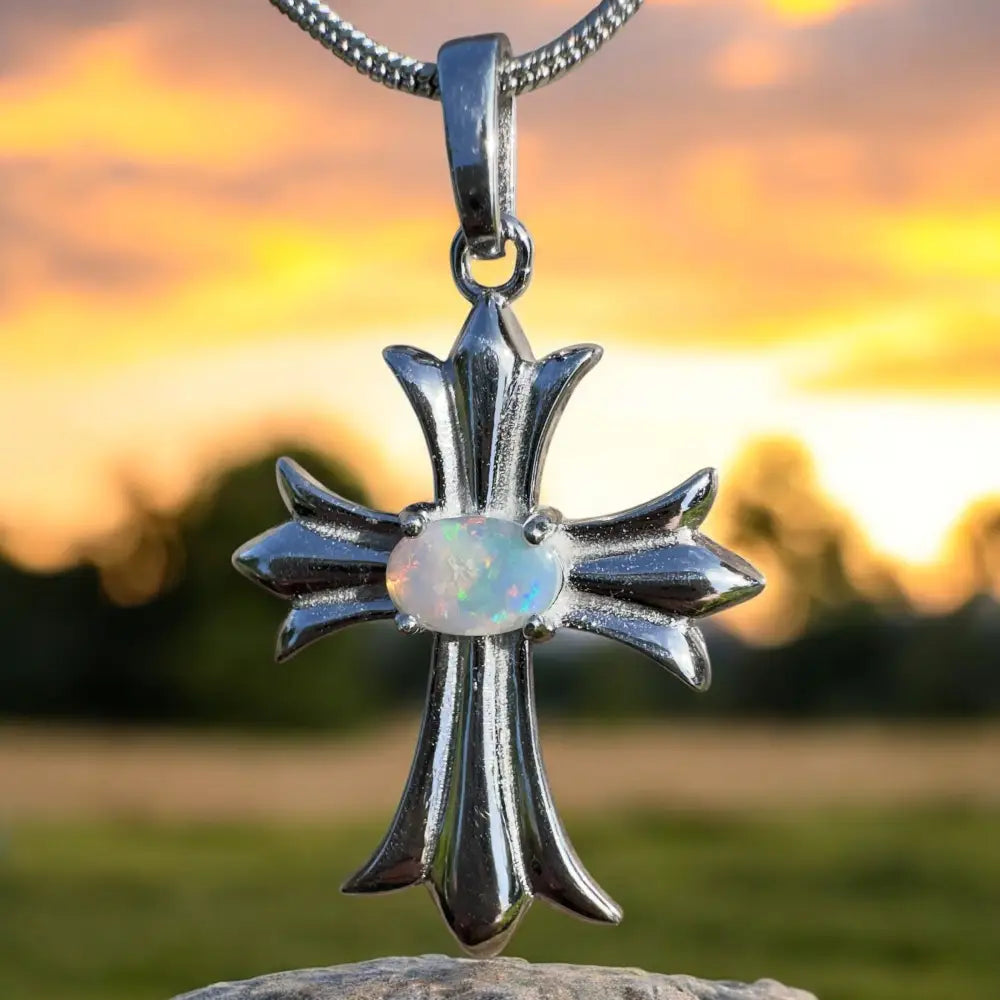 Silver cross pendant with opal.