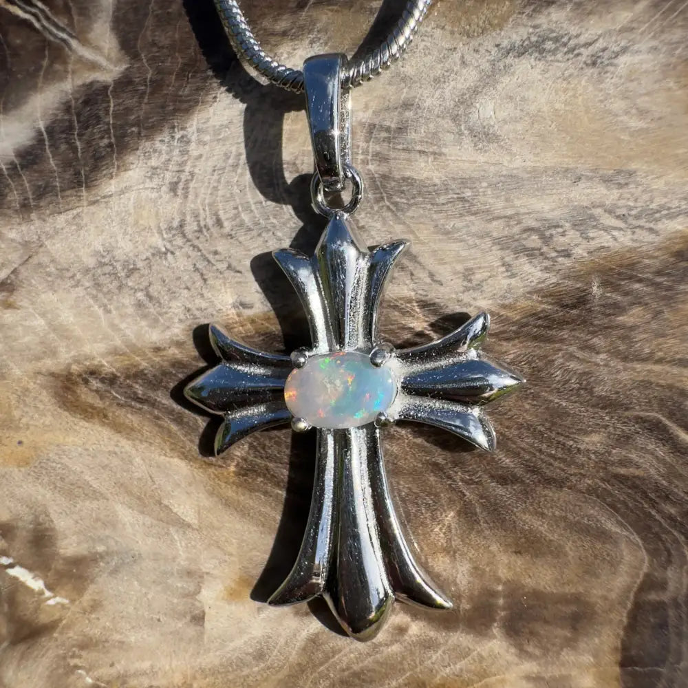 Silver cross pendant with opal.