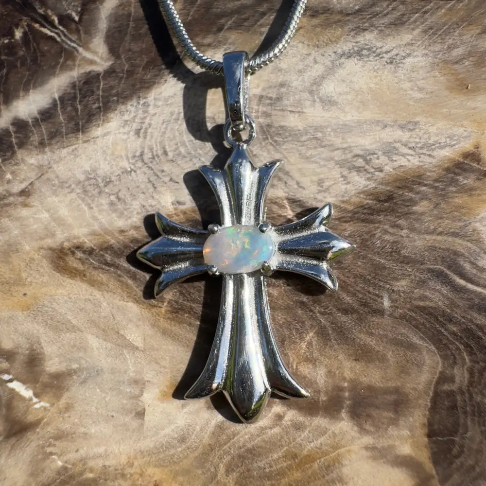 Silver cross pendant with opal.