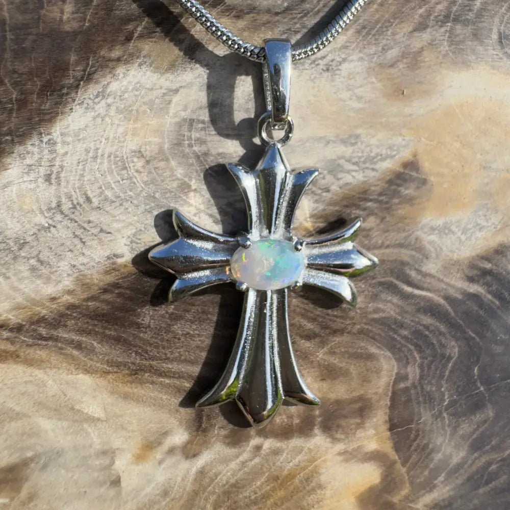 Silver cross pendant with opal.