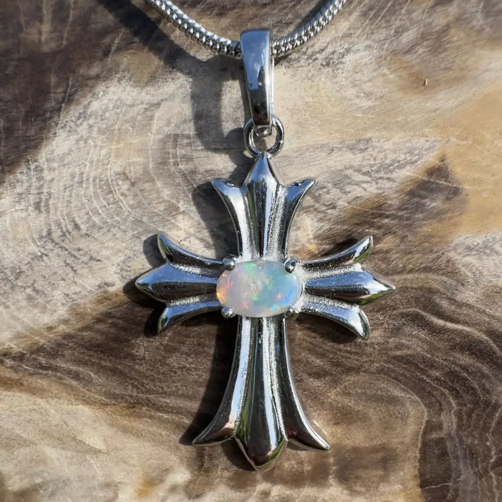Silver cross pendant with opal.
