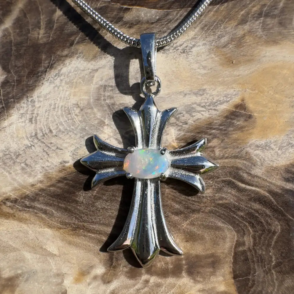 Silver cross pendant with opal.