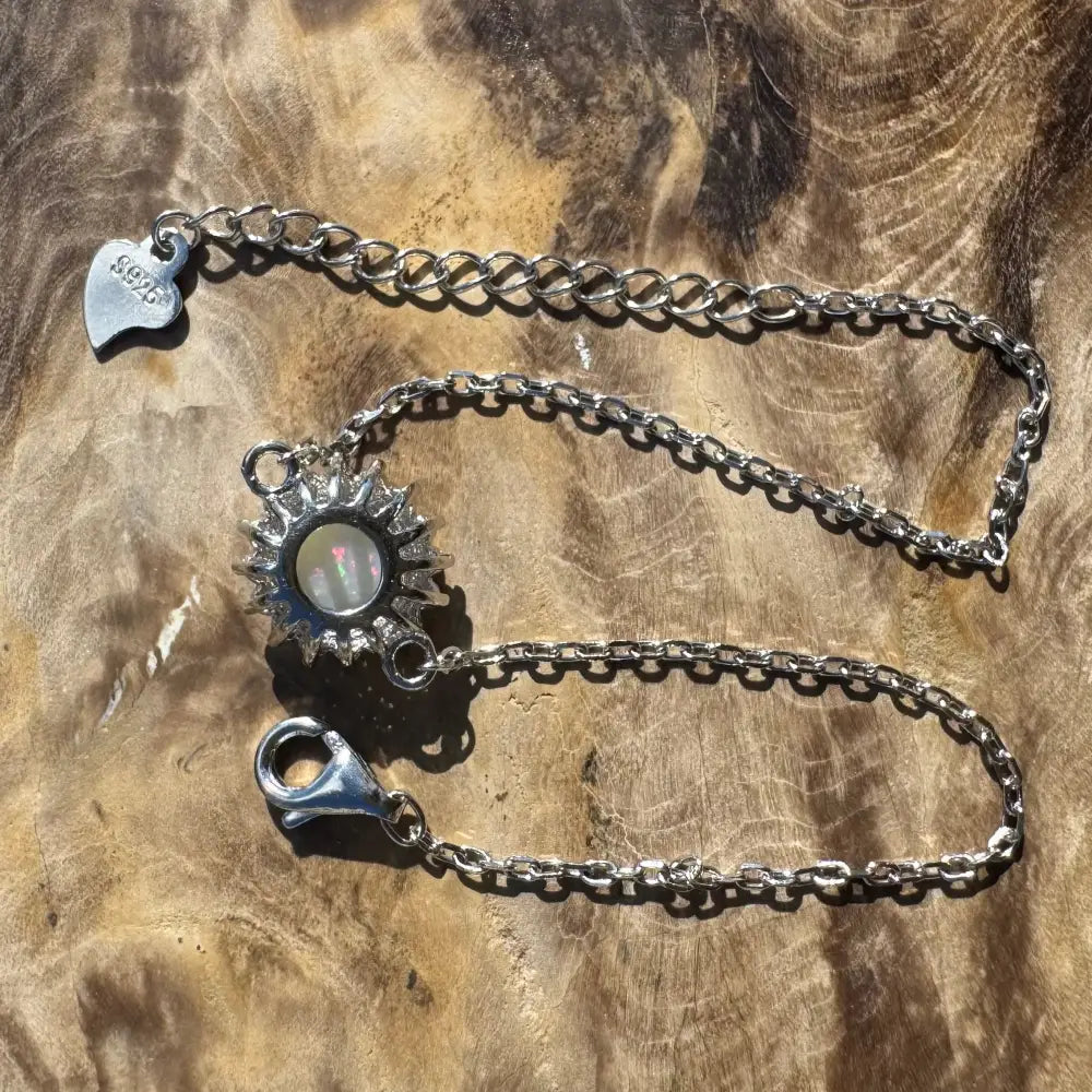 Silver sunburst opal bracelet.