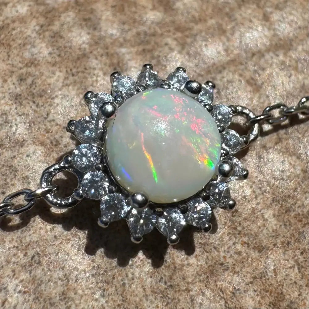 Opal and diamond pendant necklace.