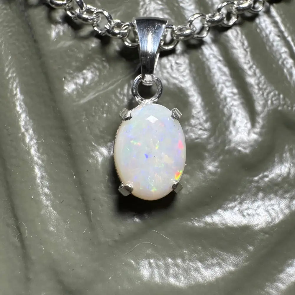 Silver chain necklace with a handcrafted 0.9ct Coober Pedy opal pendant from Three Sisters Shine