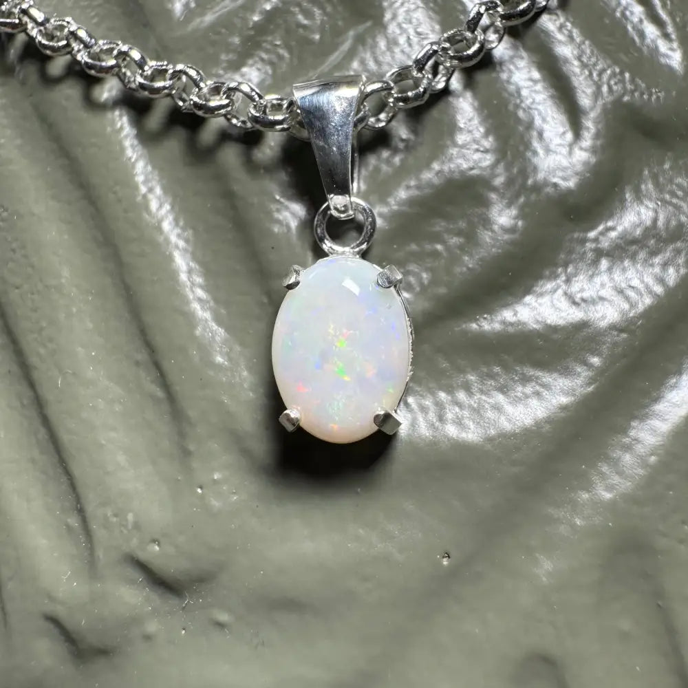 Silver chain with a stunning 0.9ct Coober Pedy opal pendant from the Three Sisters Shine collection