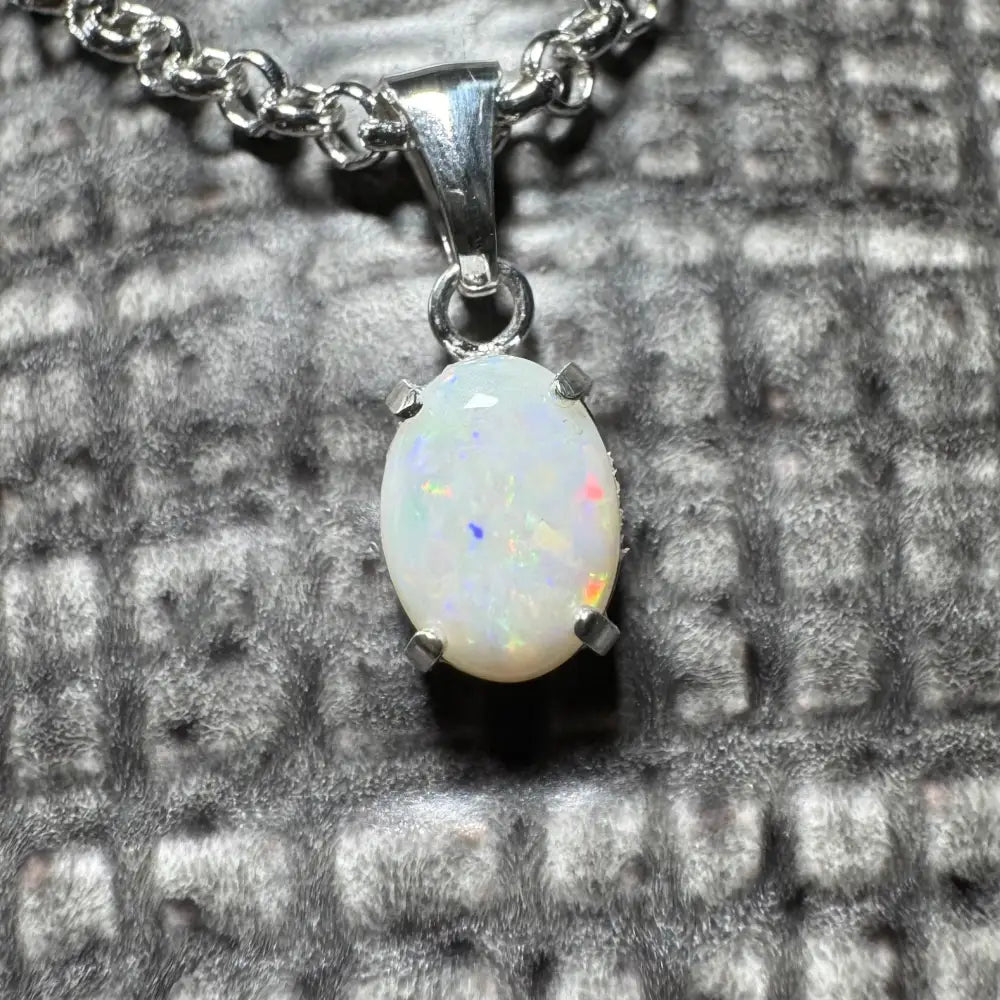 Silver chain with a handcrafted 0.9ct Coober Pedy opal pendant from Three Sisters Shine