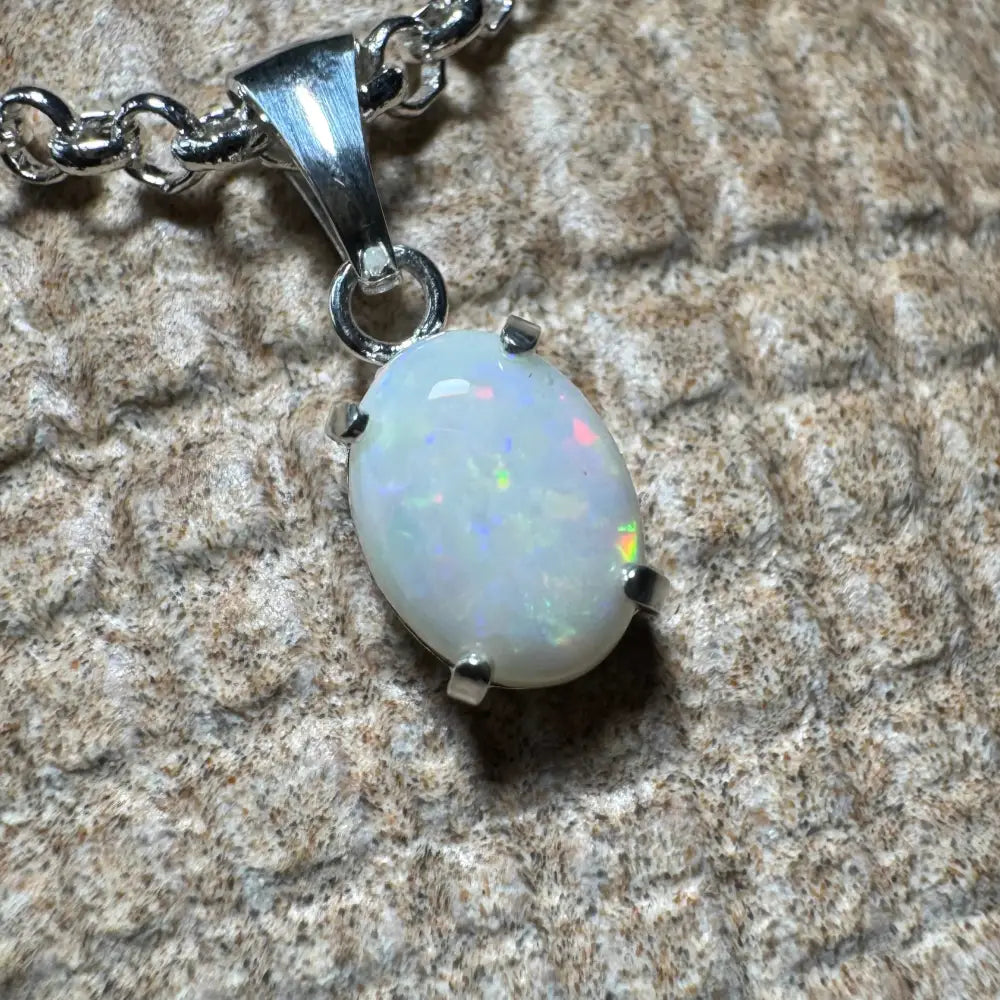 Silver opal pendant necklace featuring a handcrafted 0.9ct Coober Pedy opal in sterling silver