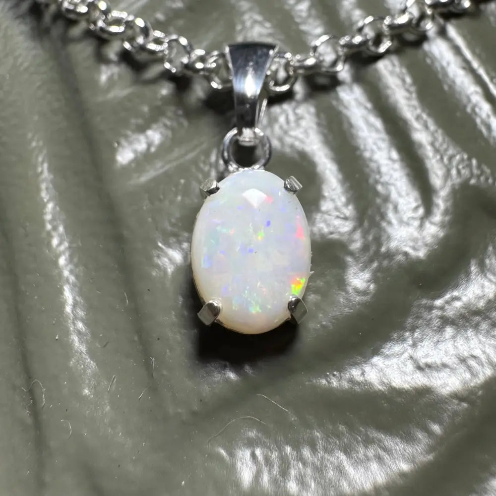 Silver chain necklace featuring a handcrafted 0.9ct Coober Pedy Opal pendant from Three Sisters Shine