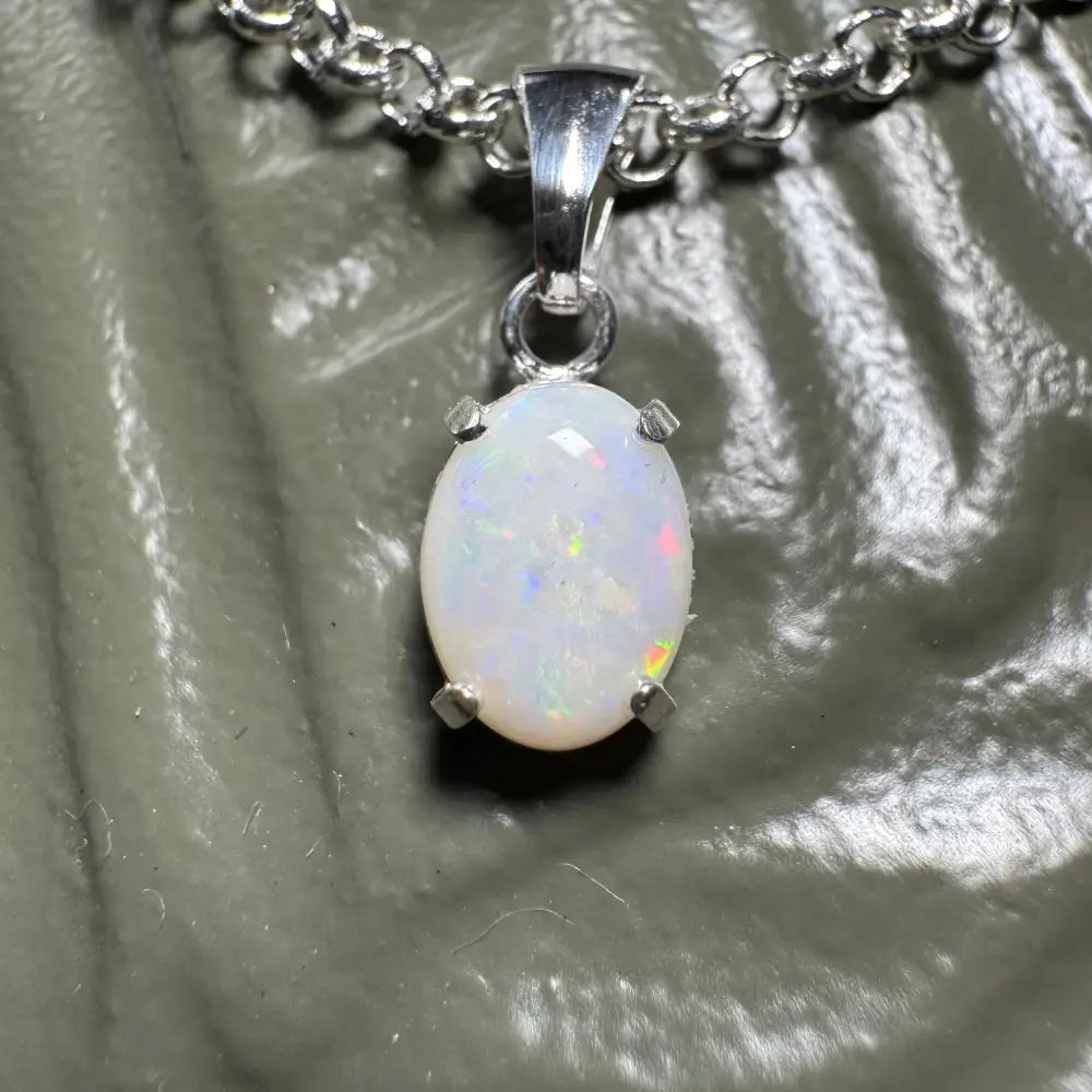Oval opal pendant with silver chain from the Three Sisters Shine handcrafted jewelry collection