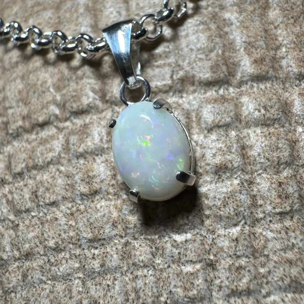 Silver opal pendant necklace from Three Sisters Shine, handcrafted with 0.9ct Coober Pedy opal and sterling silver