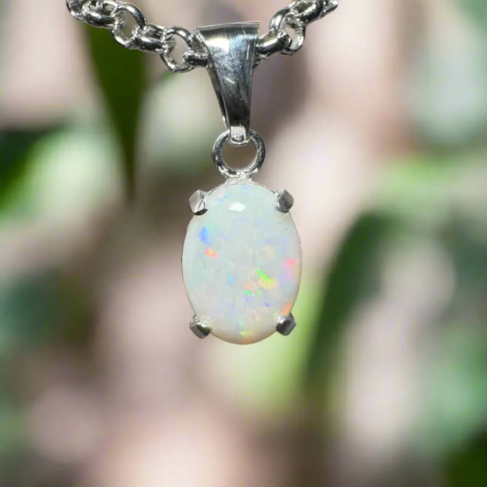 Oval opal pendant necklace from Three Sisters Shine featuring a handcrafted 0.9ct Coober Pedy Opal in sterling silver