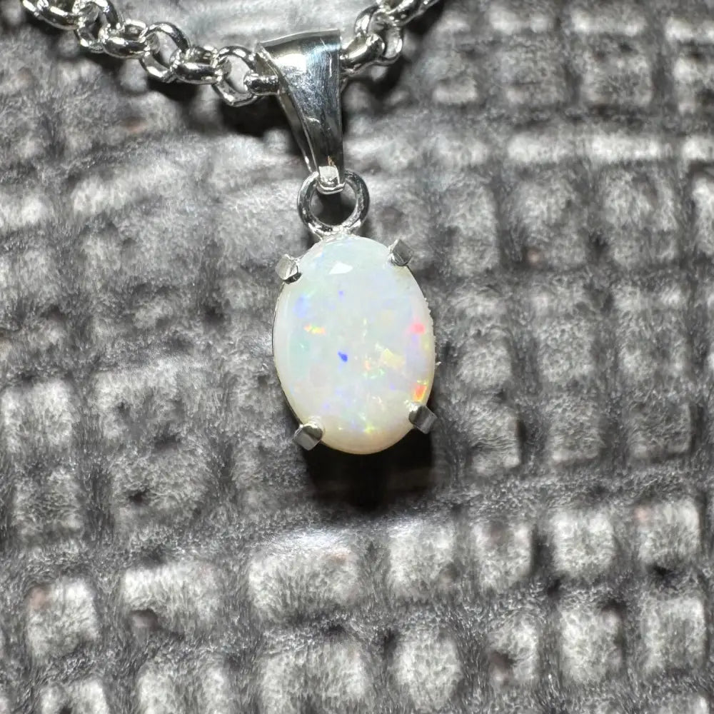 Opal pendant necklace from Three Sisters Shine featuring a handcrafted 0.9ct Coober Pedy Opal in sterling silver